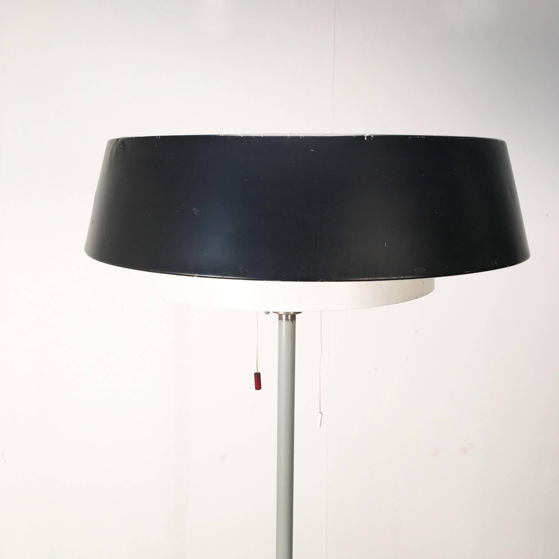 Floor lamp, designed in the 1950s by Niek Hiemstra, manufactured in the Netherlands by Evolux. This lamp is a beautiful example of the Dutch Mid-Century Industrial Design.
The lamp has four-light bulbs, one uplight and three downlights. Uplight and
