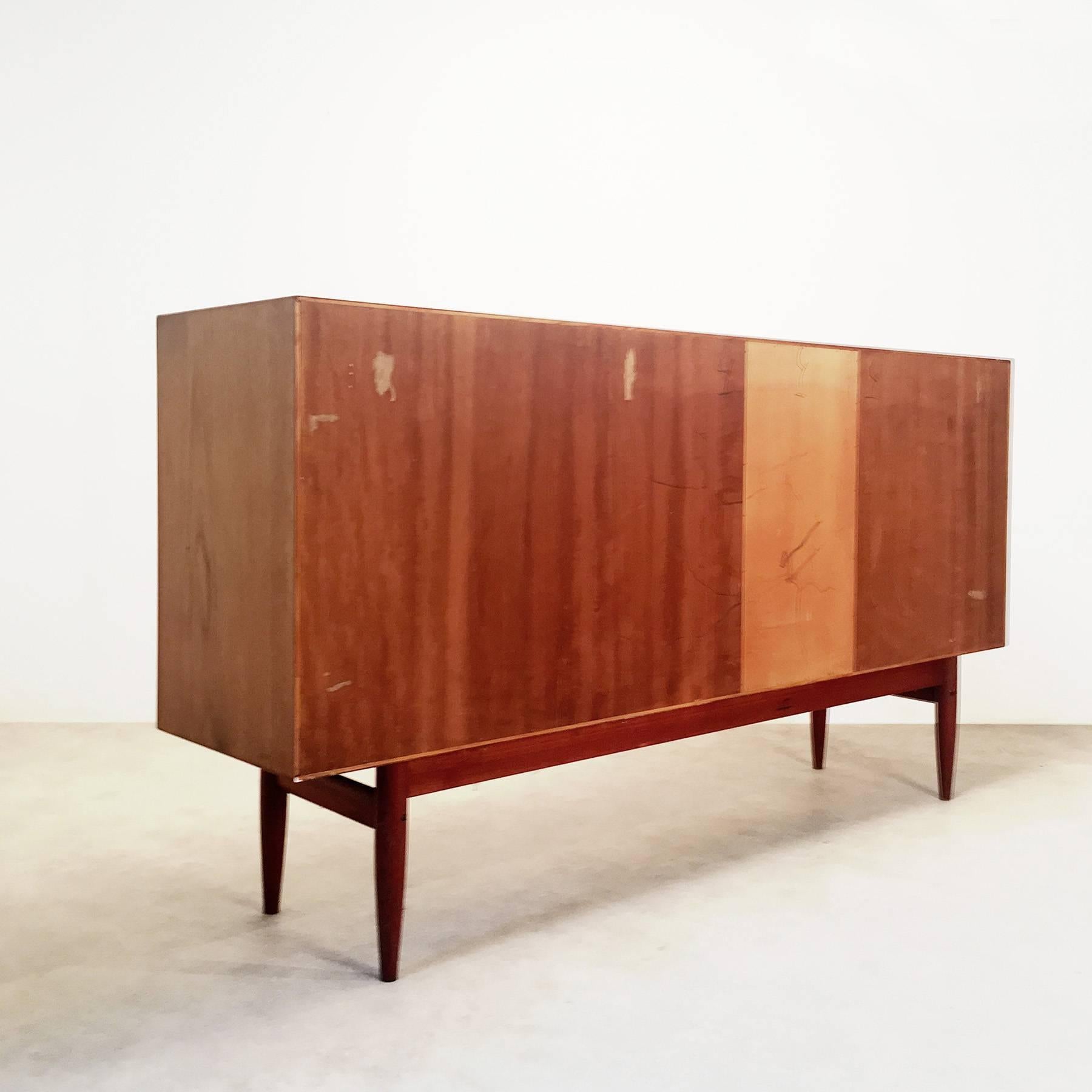 Teak sideboard, designed in the 1960s by Kurt Østervig. Beautiful piece, high quality crafted. The sideboard has an unusual height between an ordinary sideboard and a high board, so it offers lots of storage space without being as massive as a high