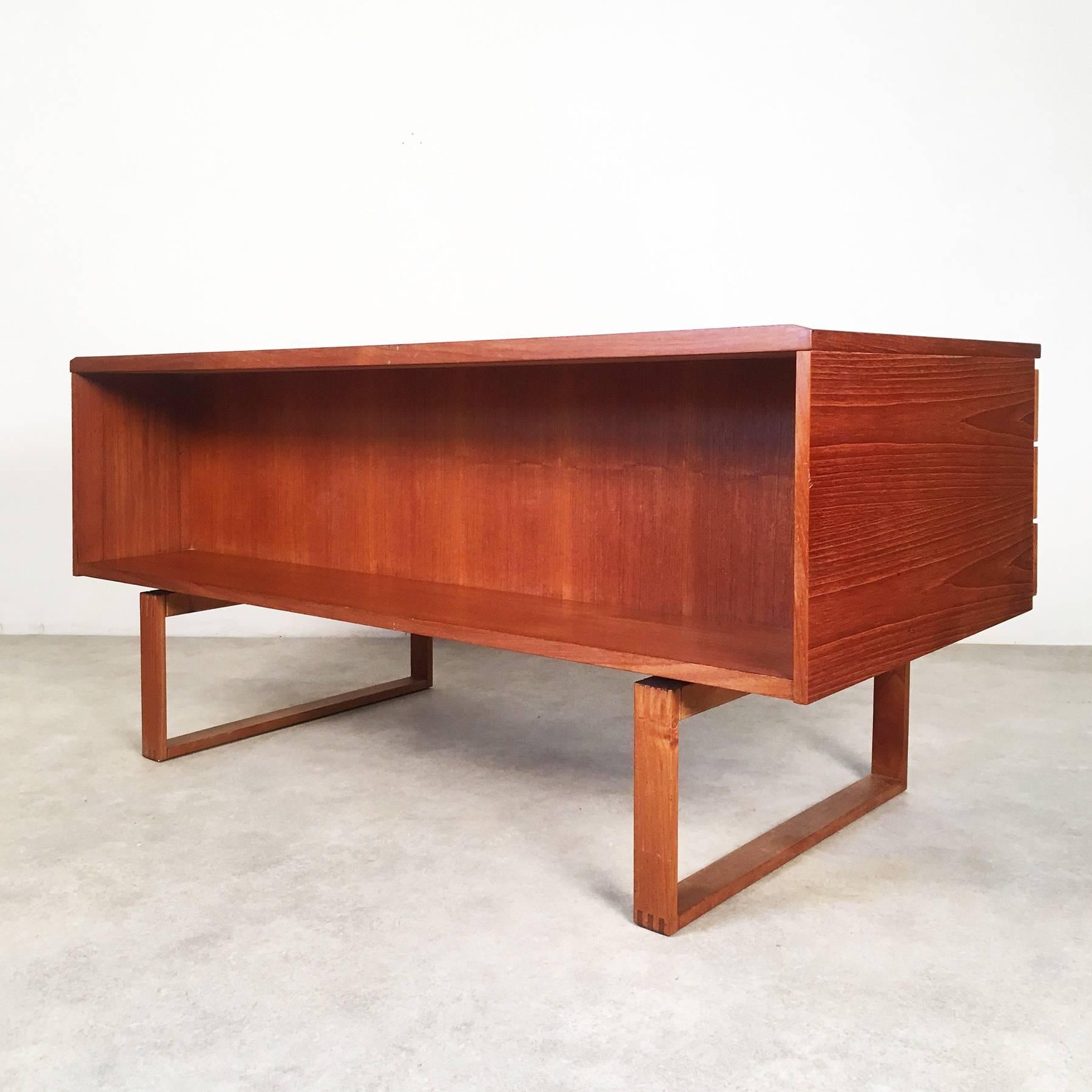 Executive teak desk, manufactured in the 1970s by Bramin. The design of this piece is usually attributed to Kai Kristiansen.

The piece stands out for its plain design with beautiful details, and a lot of storage space. It is made of teak wood.