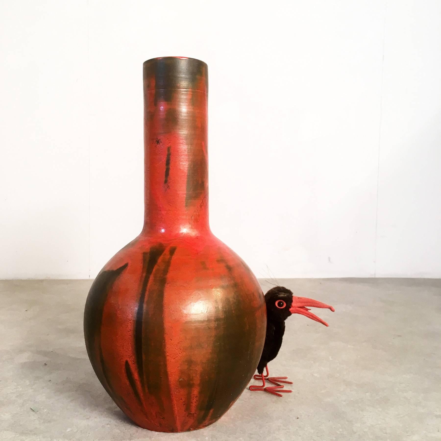 Stunning West German Pottery studio ceramic floor vase from the 1960s. Great piece, beautifully designed. The vase is completely handmade by an unknown artist. It is made of red clay and glazed in a dark greenish brown with a bright orange drip