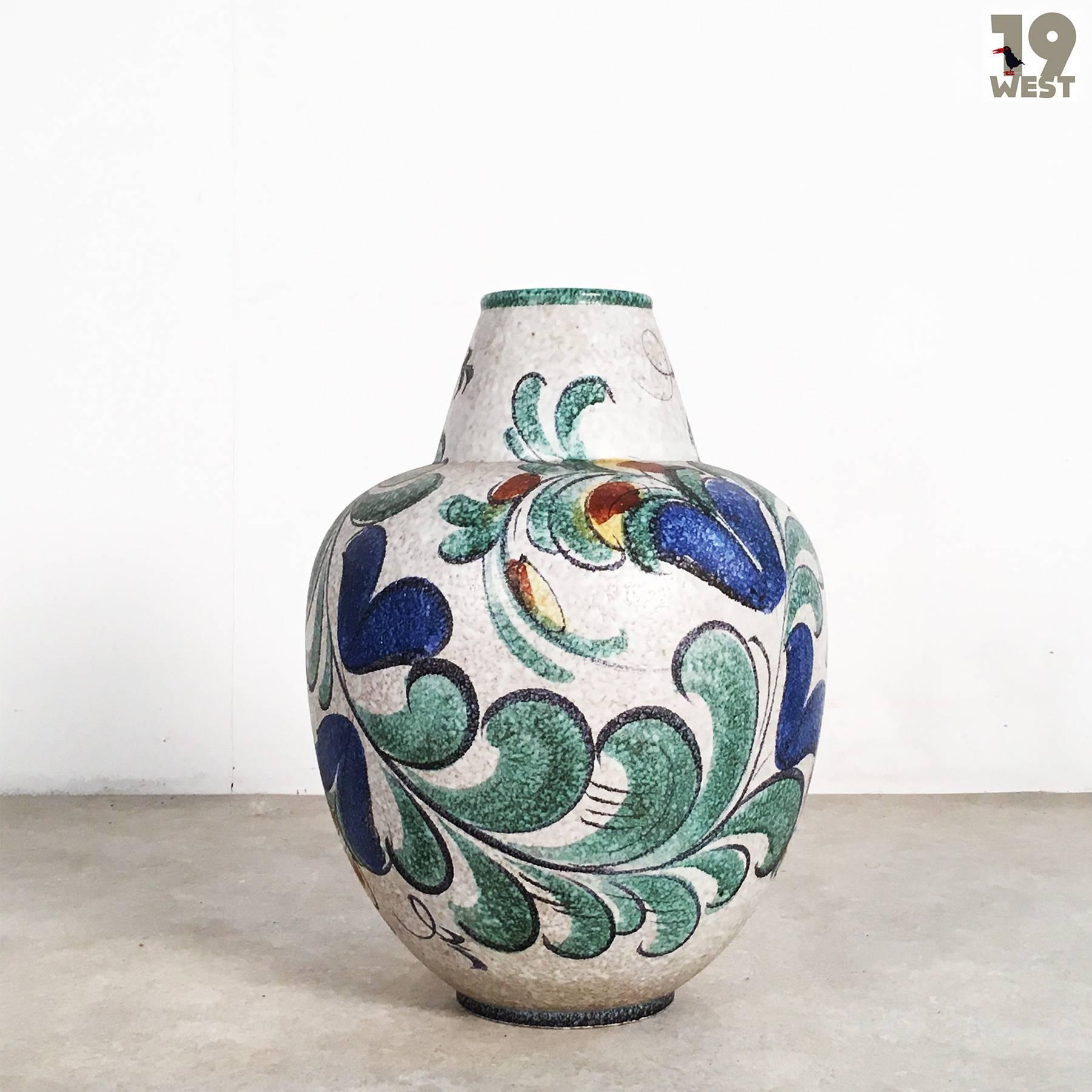 West German Pottery floor vase from the 1950s, manufactured by Ruscha. The vase stands out for its beautiful hand-painted decor, which is called 
