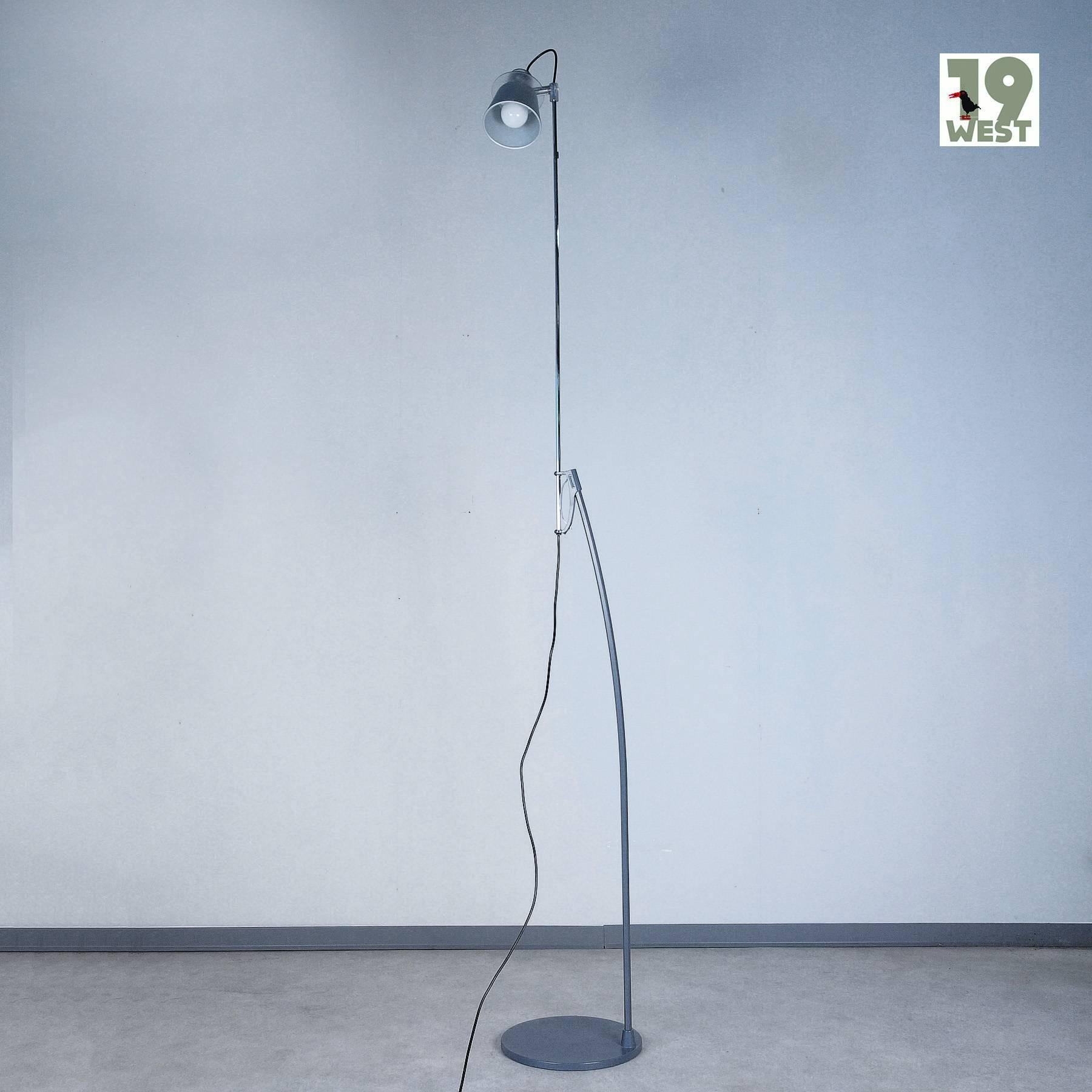 Alfiere floor lamp, designed in the 1990s by Enzo Mari, manufactured in Italy by Artemide. The Luminaire stands out for its filigree design and its variability: it can be adjusted to a height of up to 219 cm (!) and the shade can be adjusted