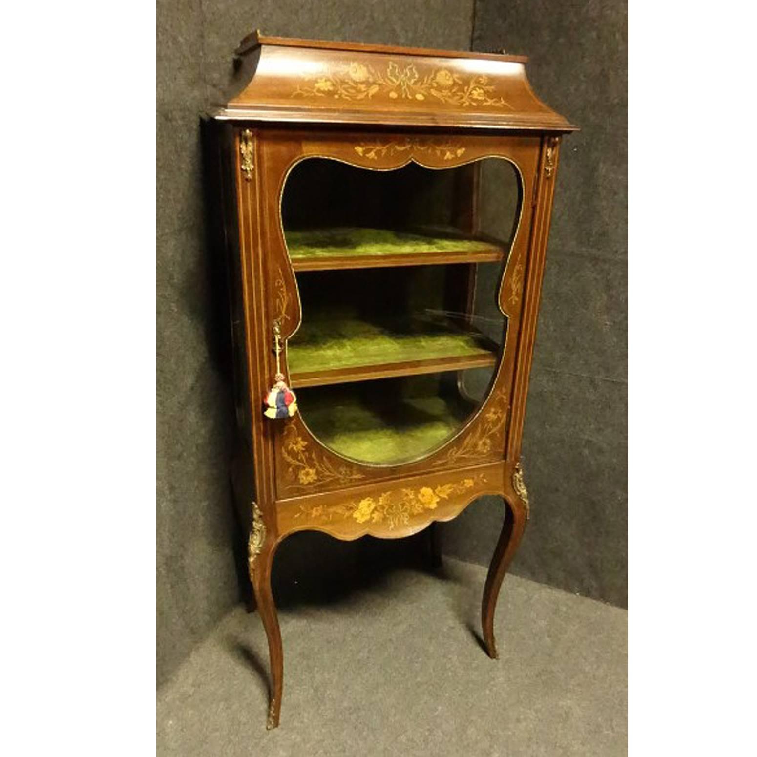 A very good Victorian mahogany display cabinet, shaped doors and sides, surrounded with brass bobble bead. Brass mounts to sides knees and toes, marquetry detailing throughout, caddy top with brass gallery, two inlaid shelves with original velvet