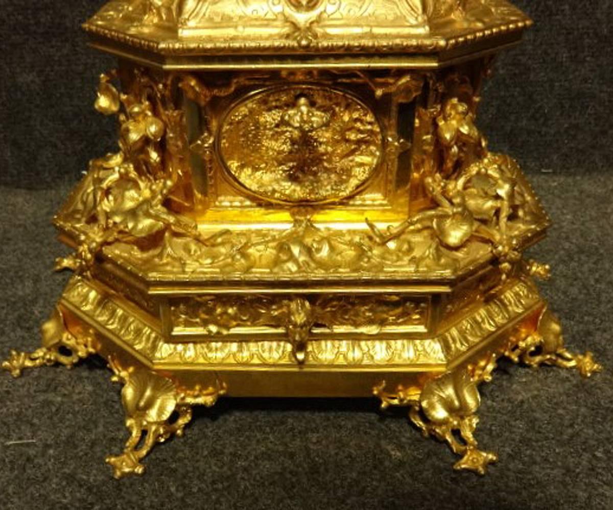 A very impressive 19th century gilt bronze table or jewelry casket, with canted corners, the pagoda top a secret hinged box, Baroque style lower box with hinged lid, secret drawer with articulated animal tongue, all covered with floral and vine
