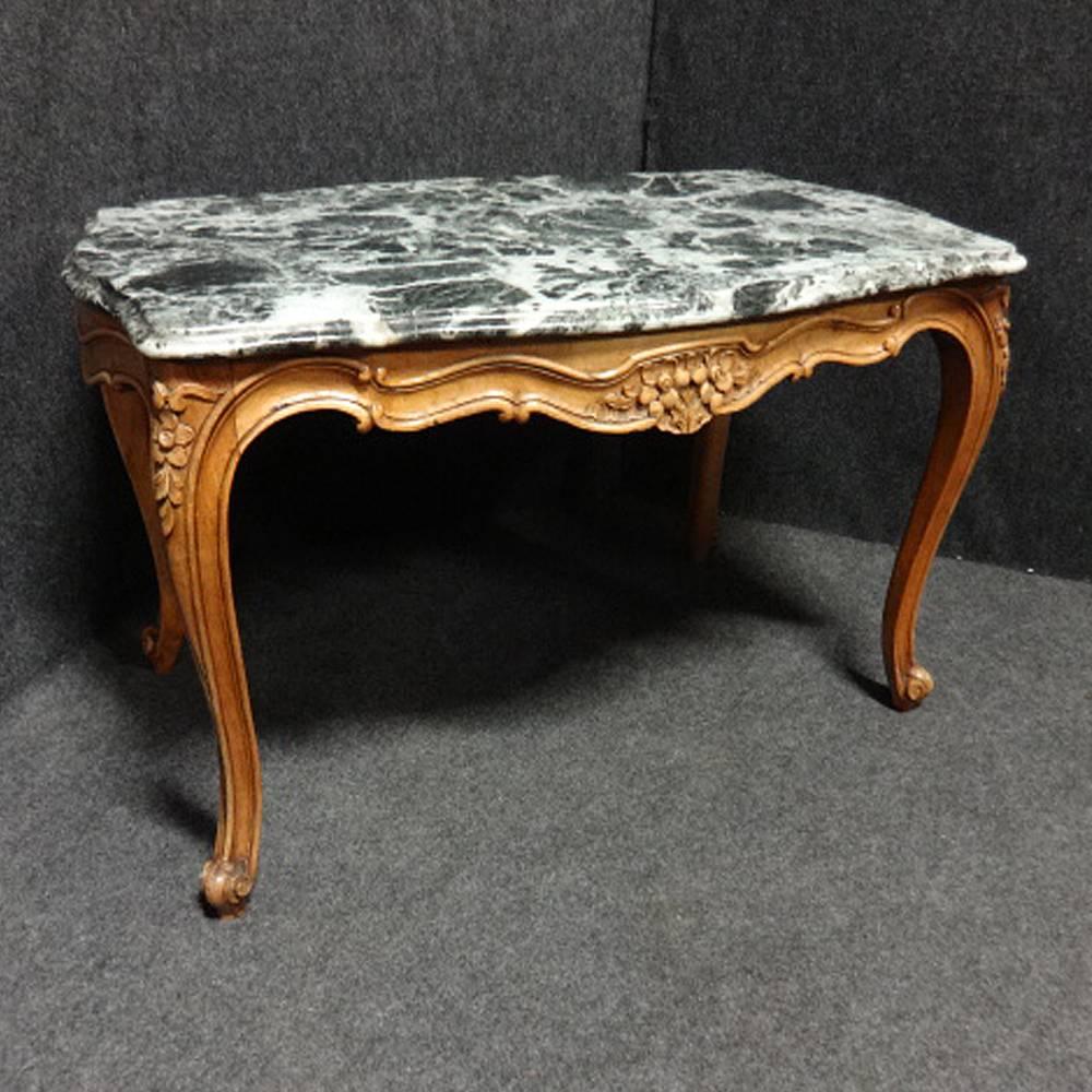 A very good French walnut coffee table with a good black and white marble top, in very good original condition.