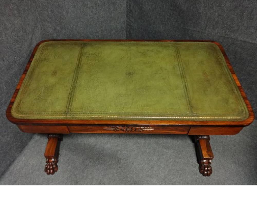 A superb William IV library desk, excellent color and condition, green leather, single drawer with rosewood motif, mirrored image to the back, lyre ends standing on paw feet.

Measures: 52" length
29.5" depth
29.5" high.