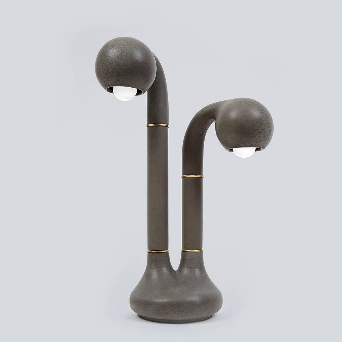 A charming, asymmetrical two-globe lamp handmade and cast in our workshop in downtown Los Angeles. Our table lamp will bring sense of joy and light to brighten your space.

Glazes are in gloss black, matte black, charcoal, pink, alabaster, yellow,