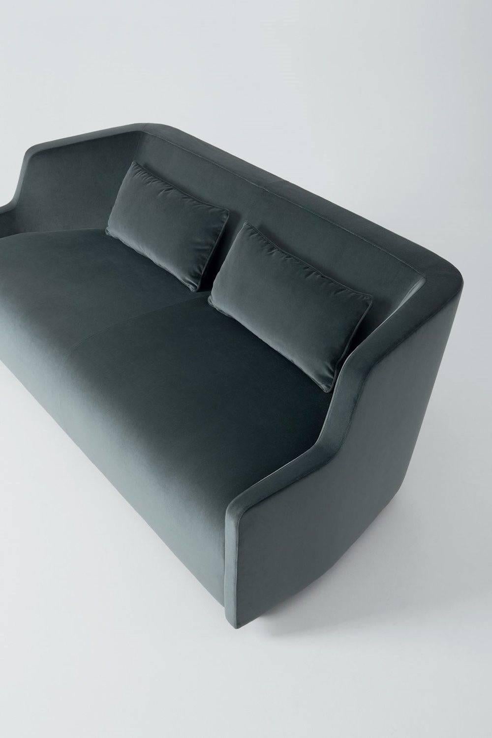 Sofa in non-deformable foam polyurethane in different density and polyester fibre with wooden inside structure. Black lacquered wooden feet. Available covered by fabric or leather. Decorative polyester fibre cushions, on request.

Dimsensions: