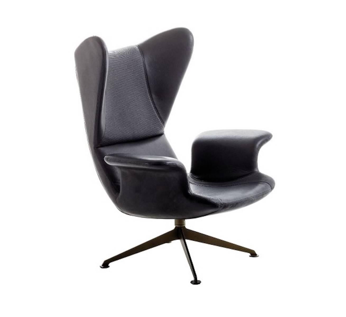 Retuning a Classic! Like a 1960s motorcycle with a new engine, every bit the attitude, but still a modern machine. 

A high back lounge chair with constant flowing lines, this has been designed as a personal space within the home or office for the