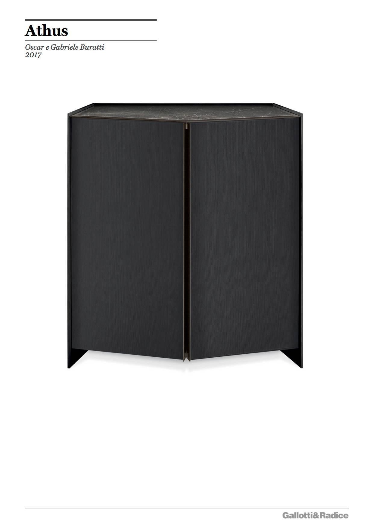 High cabinet in black open pore lacquered ash. Patinated bronze lacquered metal details. Grey stardust or Sahara noir marble top. Supplied with 10 mm tempered extra light glass shelf and mirrored inside back.
Size:
125 W x 55 D x 136 H