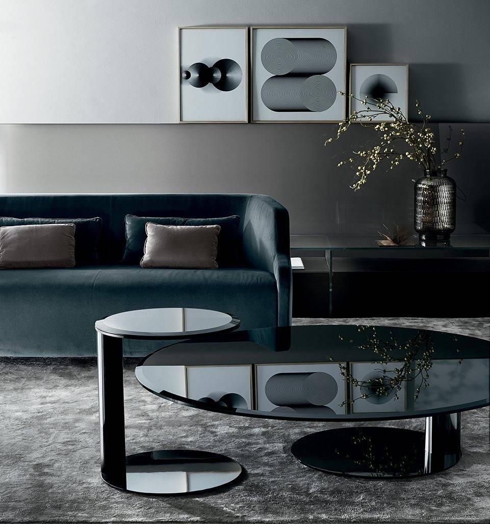 Side table with bevelled and bright painted glass top. Bright lacquered metal structure. Available in the colors black, blue grey and liquorice.

Dimensions:
cm
Ø 45 x 50 H
inches
Ø 17.75 x 19.75 H