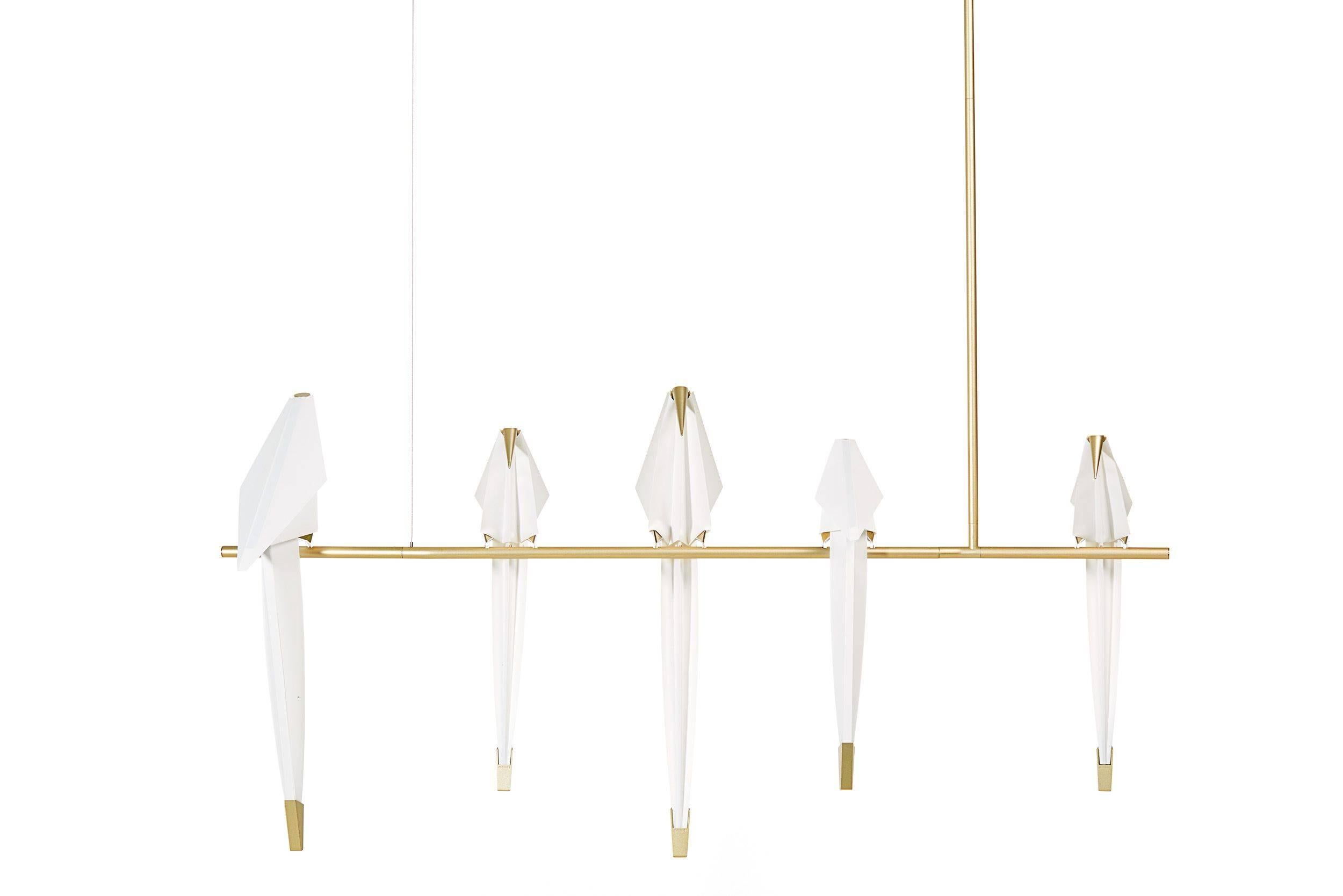 Perch light branch.  
Moooi Perch Light Branch Chandelier with LED bulbs.

A bird is gracefully balanced on a tall metal perch, beautiful and proud, a swinging glimmer of warm light. Yet you are inside, after daylight has faded, under the spell of