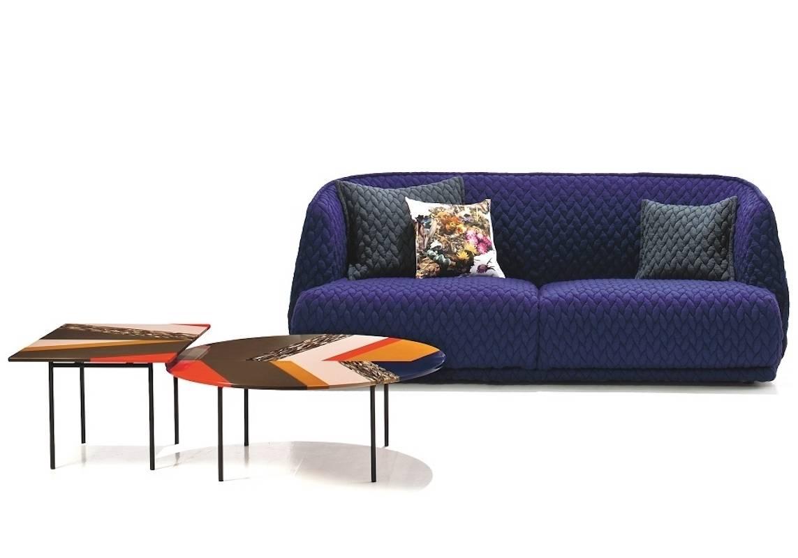 Moroso Redondo three-seat sofa in quilted upholstery by Patricia Urquiola.

A collection with a distinctive two–part shape, the padded shell embraces the huge seat cushions. Its curves are shown off by the total absence of sharp corners and the