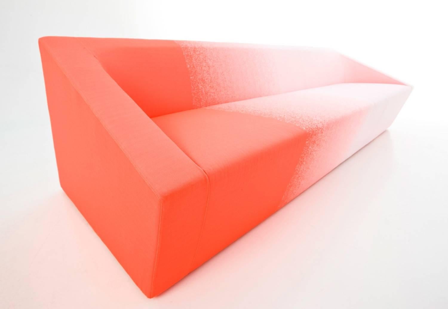 Moroso blur sofa by Marc Thorpe in white and orange neon blur fabric.

Blur is a study of architectural invisibility. Through the physical suggestion of disappearance the designer questions the relationship between form and background. A