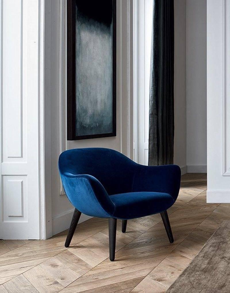 Poliform mad armchair by Marcel Wanders in Navy Blue Velvet & Wood legs.

Marcel Wanders’s mad chair has a harmonic structure creating strong suggestions: The ideal of a design without any material boundaries of great impact.

Price listed is