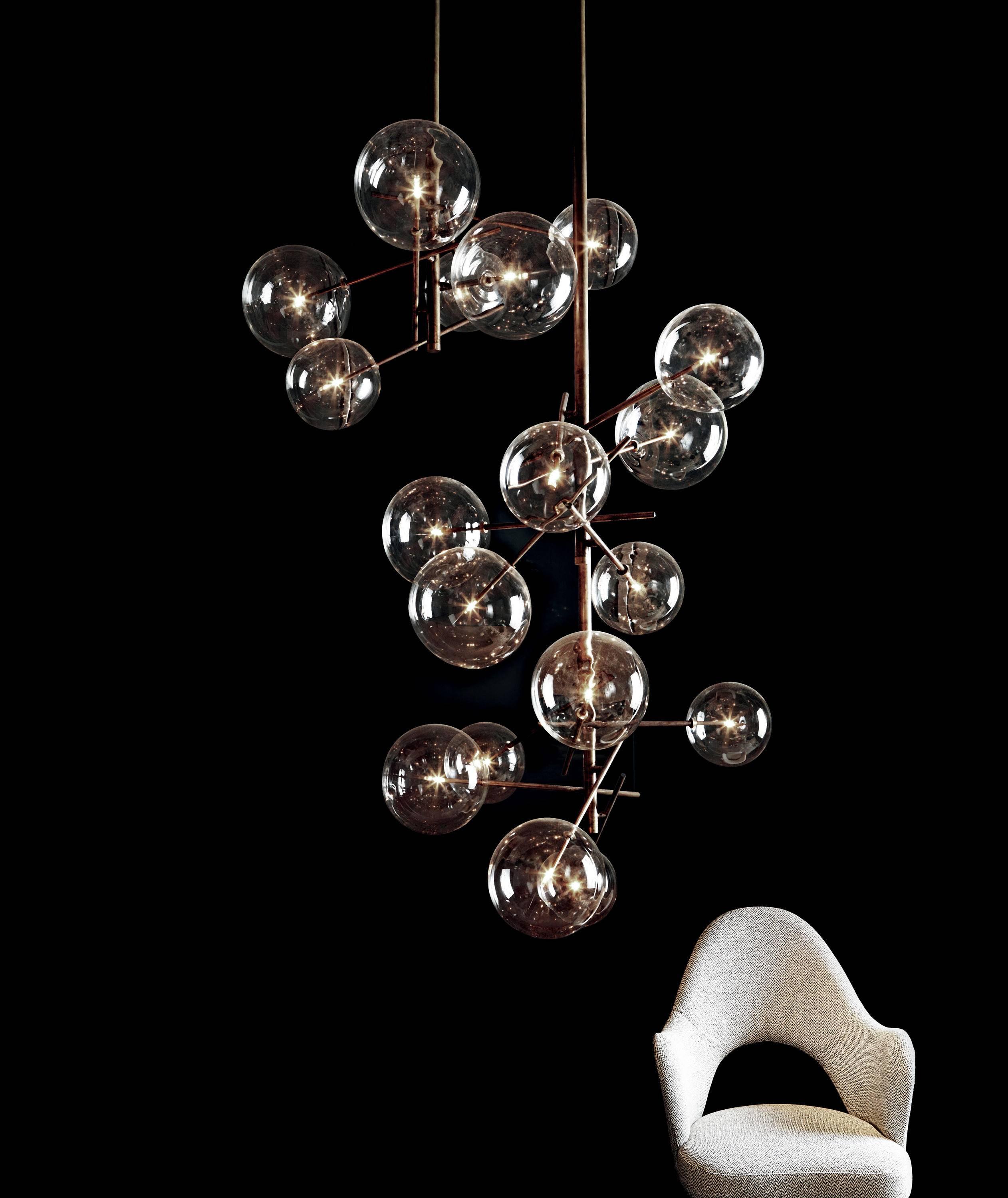 Gallotti & Radice Bolle 6 Sphere Suspension Lamp in Glass and Burnished Brass.

Hanging pendant lamp with six transparent blown glass spheres. Also available in a version with four spheres. Metal stems in hand burnished brass which will patina over
