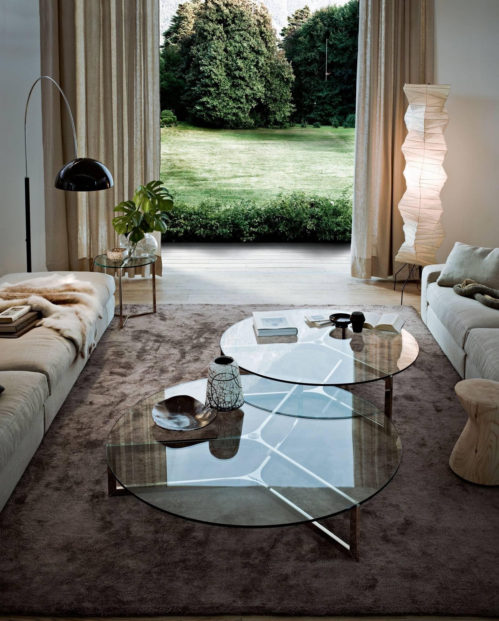 Raj one coffee table by Ricardo Bello Dias for Gallotti & Radice. 

Coffee table with 12 mm transparent tempered glass top. Bright stainless steel base. Available also with tempered smoked “grigio Italia” glass top and dark burnished metal