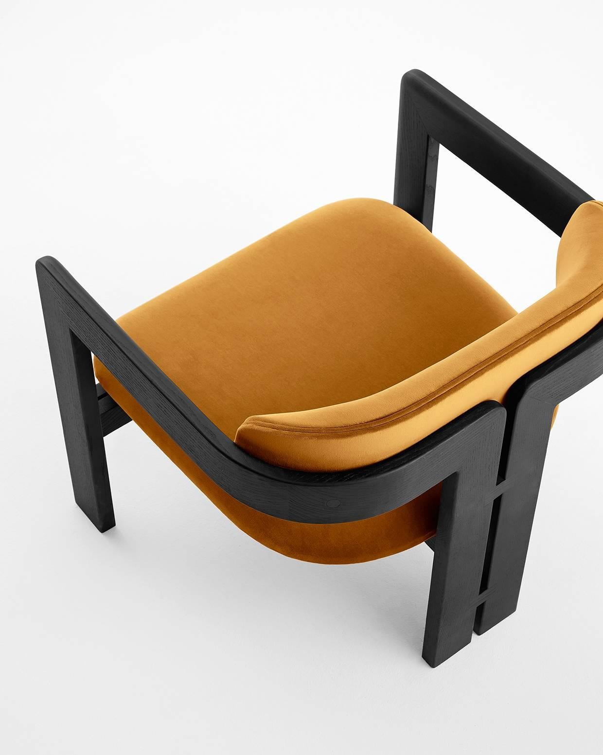 Armchair with black lacquered open pore ash structure. Available also in natural ash, tobacco stained or white open pore lacquered ash. Seat and backrest covered by fabric or leather.

Please inquire for fabric options. COM also available upon