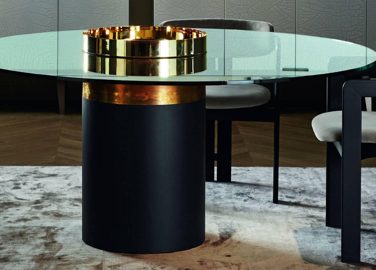 Dining, Breakfast or Bistro table with 15mm transparent tempered glass top. Black open pore or rust lacquered wooden base. Bright brass, hand burnished brass, coppered brass or black chromed metal parts. Removable tray.
 
Available in various
