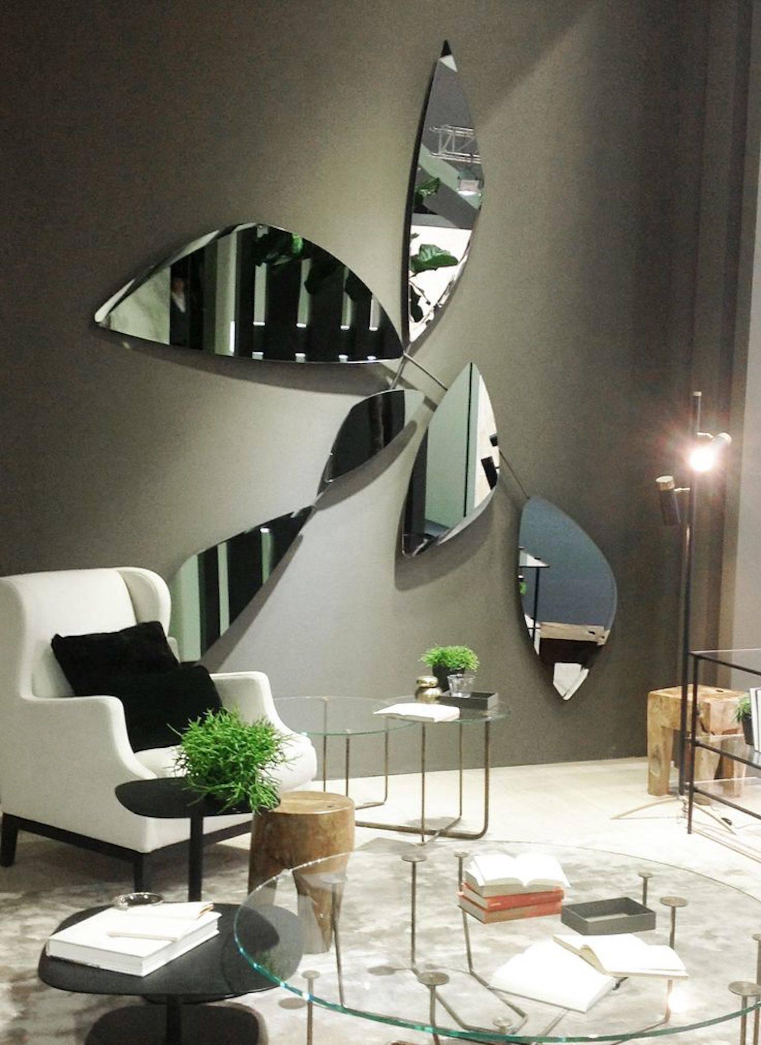System of extra light or “grigio Italia” smoked bevelled mirrors fixed on panels on different tilts. Available in single panes or as per standard compositions. 

Chromed or burnished metal joint structure.

Sizes in cm:

Composition #1- 215 x