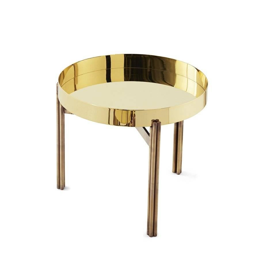 Coffee or side table with bright brass plate. Hand burnished brass structure. Price listed is for the Ø 10¼ x 15½ H.

Three sizes available: 

Cm:

Ø 49 x 47 L
Ø 26 x 39 M
Ø 19 x 50 S.


Inches:

Ø 19½ x 18.75 H = L
Ø 10¼ x 15½ H =