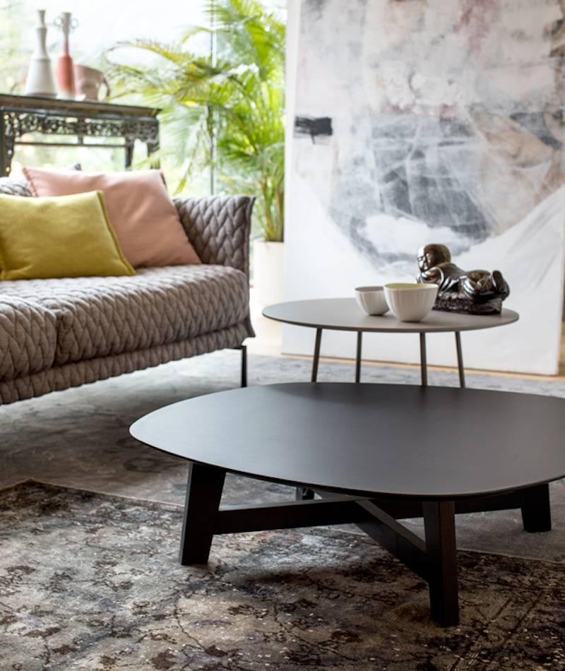 Moroso Phoenix coffee table with wood base and various color top options.

Low tables with wood base. Three- and four-leg wood bases are solid oak. Top is a super durable Laminam® composite. Top underside is beveled and has matt black lacquer