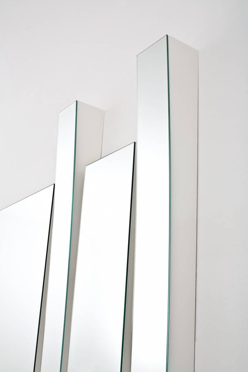 Gallotti and Radice changes 09 mirror by Patricia Urquiola 

Modular system of concave (A and B) and regular (C) mirrors and white lacquered wooden frame (max thickness 10 cm). 

They can be placed in a vertical or horizontal position both