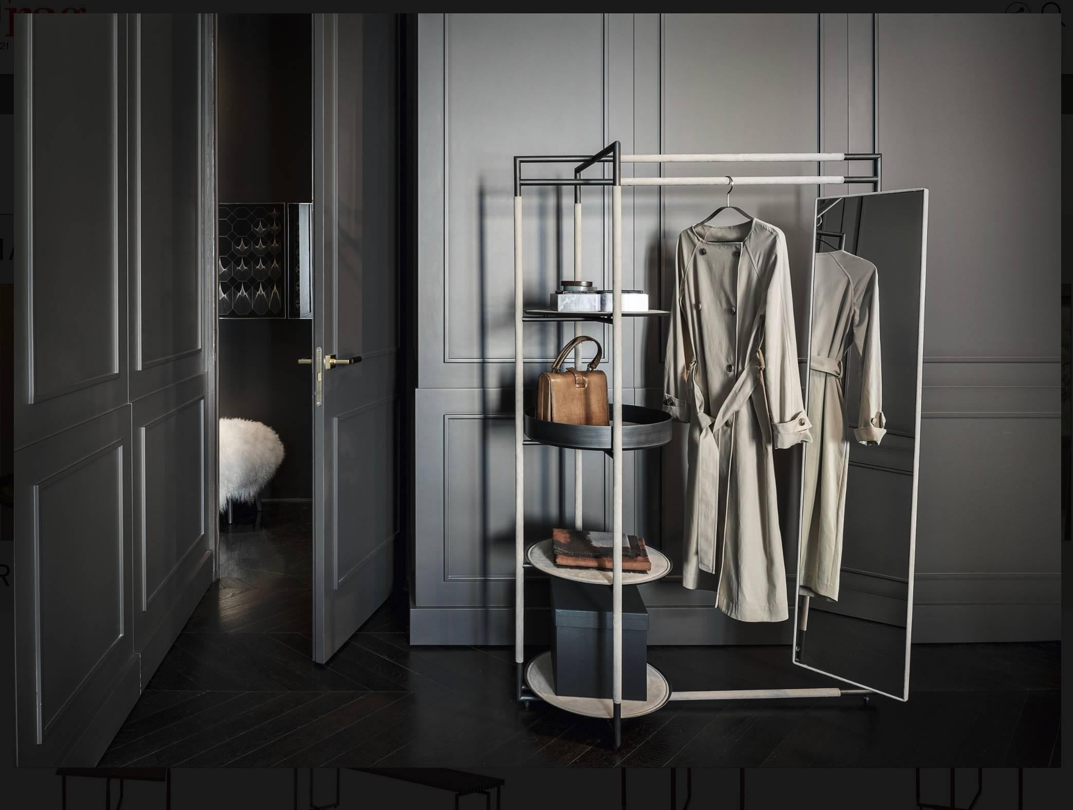 Bak Valet stand mirror
by Ferruccio Laviani

Valet stand with a brushed black steel frame upholstered with leather and slightly padded leather-upholstered steel shelves.

Measure: H 165 x W 102 x D 49.