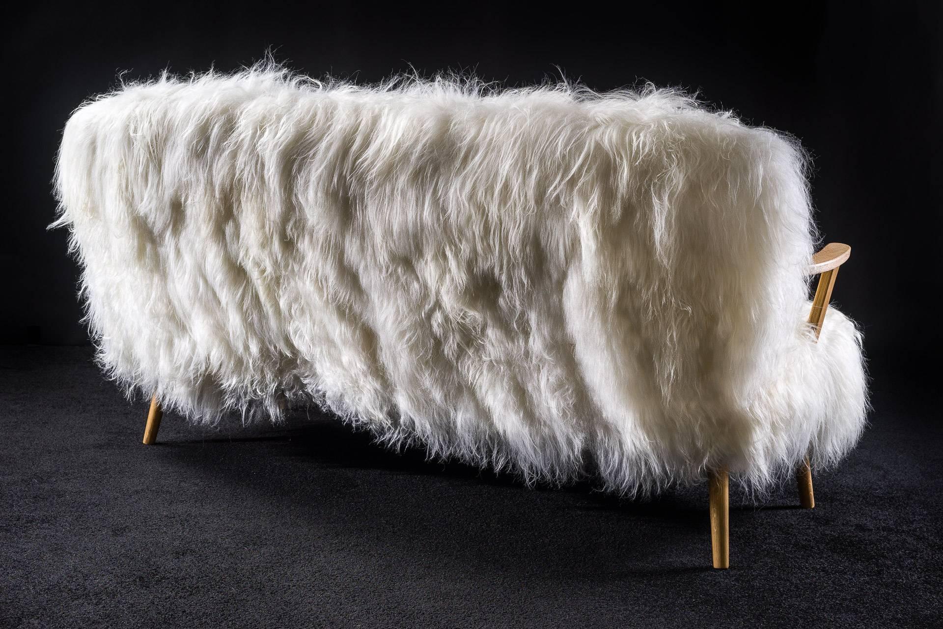 Amazing and cozy sofa with natural white Icelandic sheepskin upholstery.
Solid oak frame.
Handmade by Norki in France.
