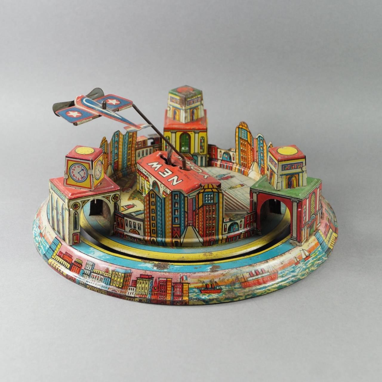 This rare and colorful working Marx mechanical wind up tin plate toy was produced by Louis Marx and Company in 1928. The company was founded by Louis Marx in 1919, and by the early to mid-19th century it was the biggest toy company in the world. In