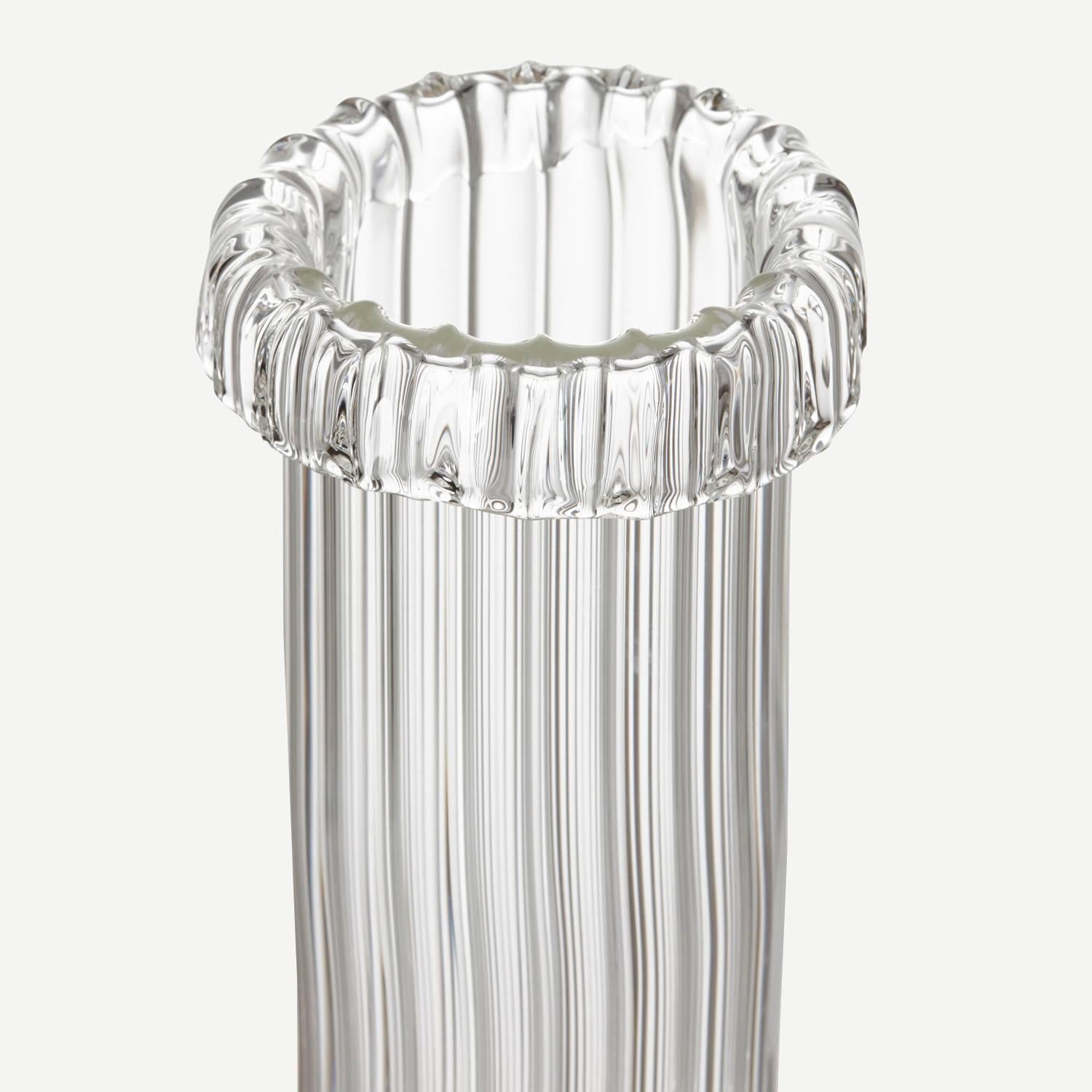 Inspired by the movement of water, this free blown Borosilicate (heat resistant and durable) glass vase has been made with a unique ribbed surface and an organic shape. Jochen made the vase exclusively with the new craftsmen as part of the bathing