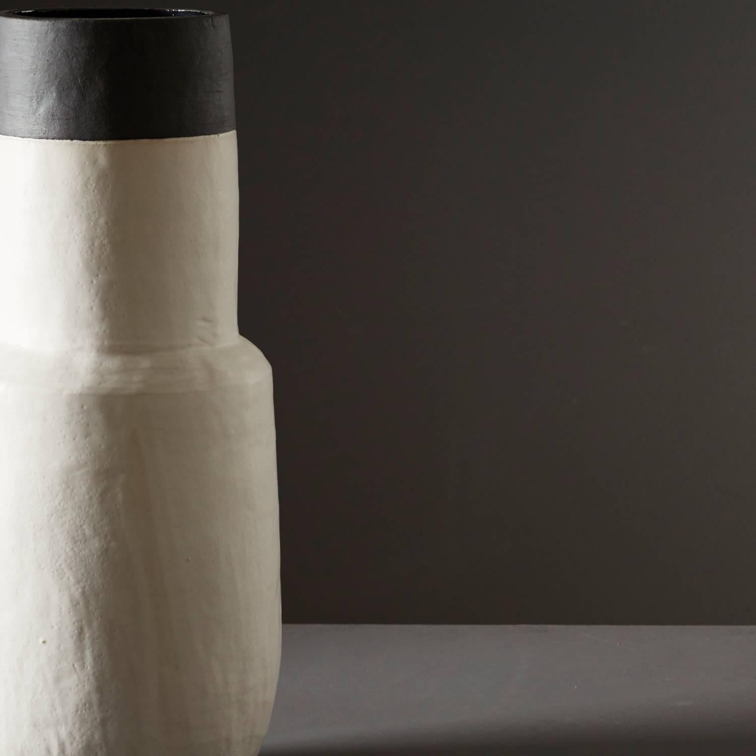 Daniel Reynolds' charcoal and chalk white parallel bottle is part of a handmade ceramics range inspired by the methods of the ancients.
Daniel’s large hand built pots operate as striking focal points, helping to define larger spaces, highlight