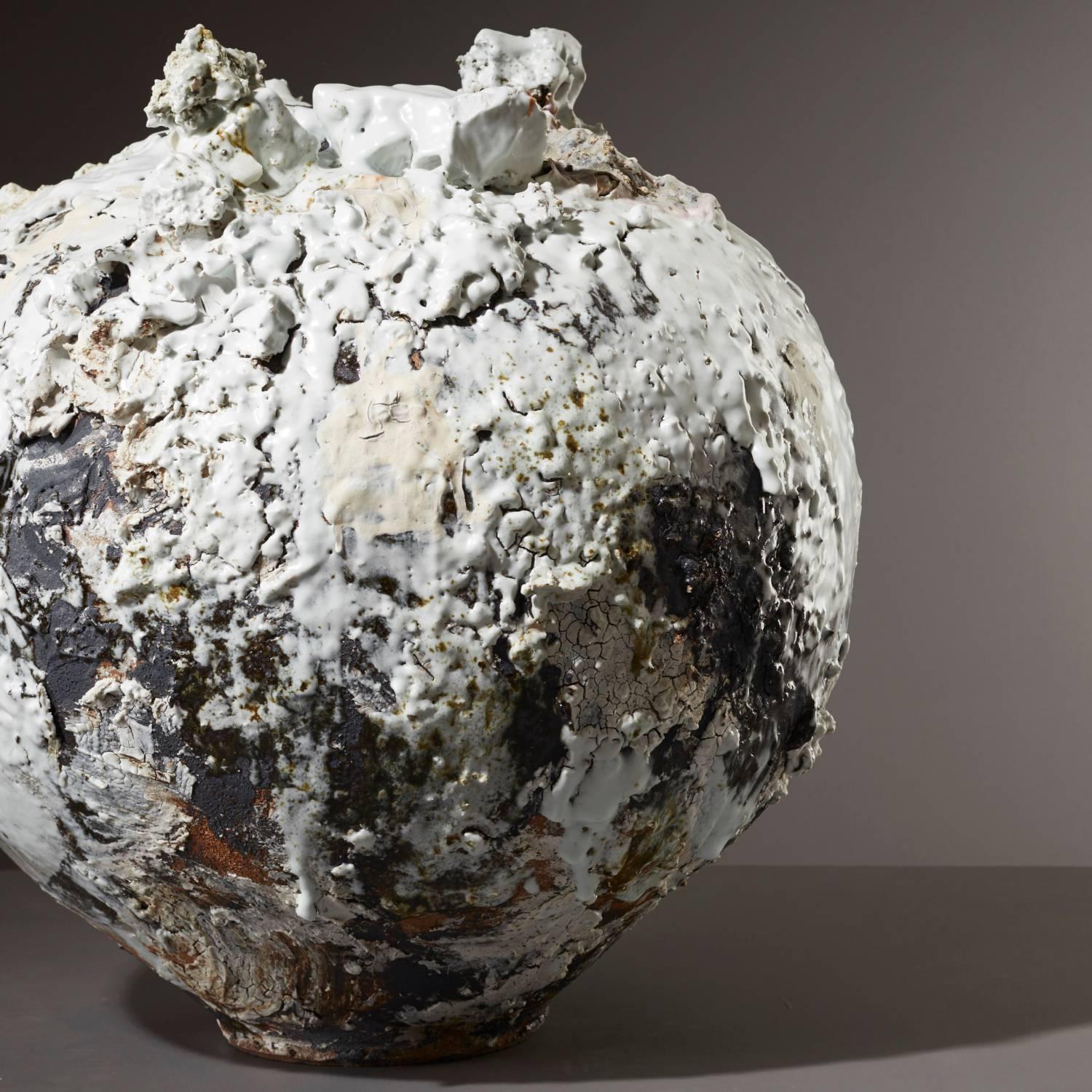 The iconic Moon Jar is a traditional form of Korean vessel with an almost mythological status. Moon Jars are characterised by their round shape and smooth, milky white glaze, reminiscent of the full moon.

Akiko Hirai challenges these themes with