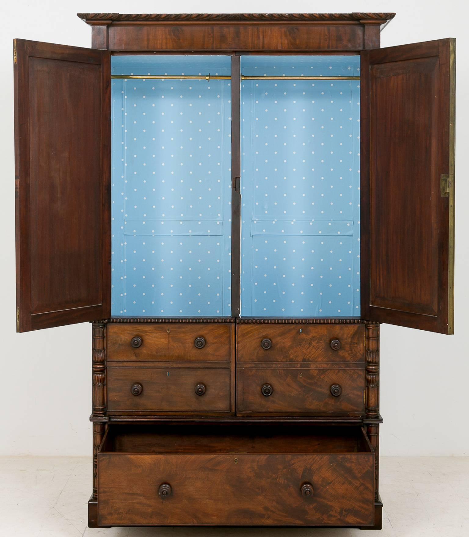 William IV mahogany Gentleman’s wardrobe.
Standing on a plinth base with one full width working drawer and four faux drawers (to give extra hanging space in the top section)
Above there are two cupboards with superb quality mahogany veneers.
This