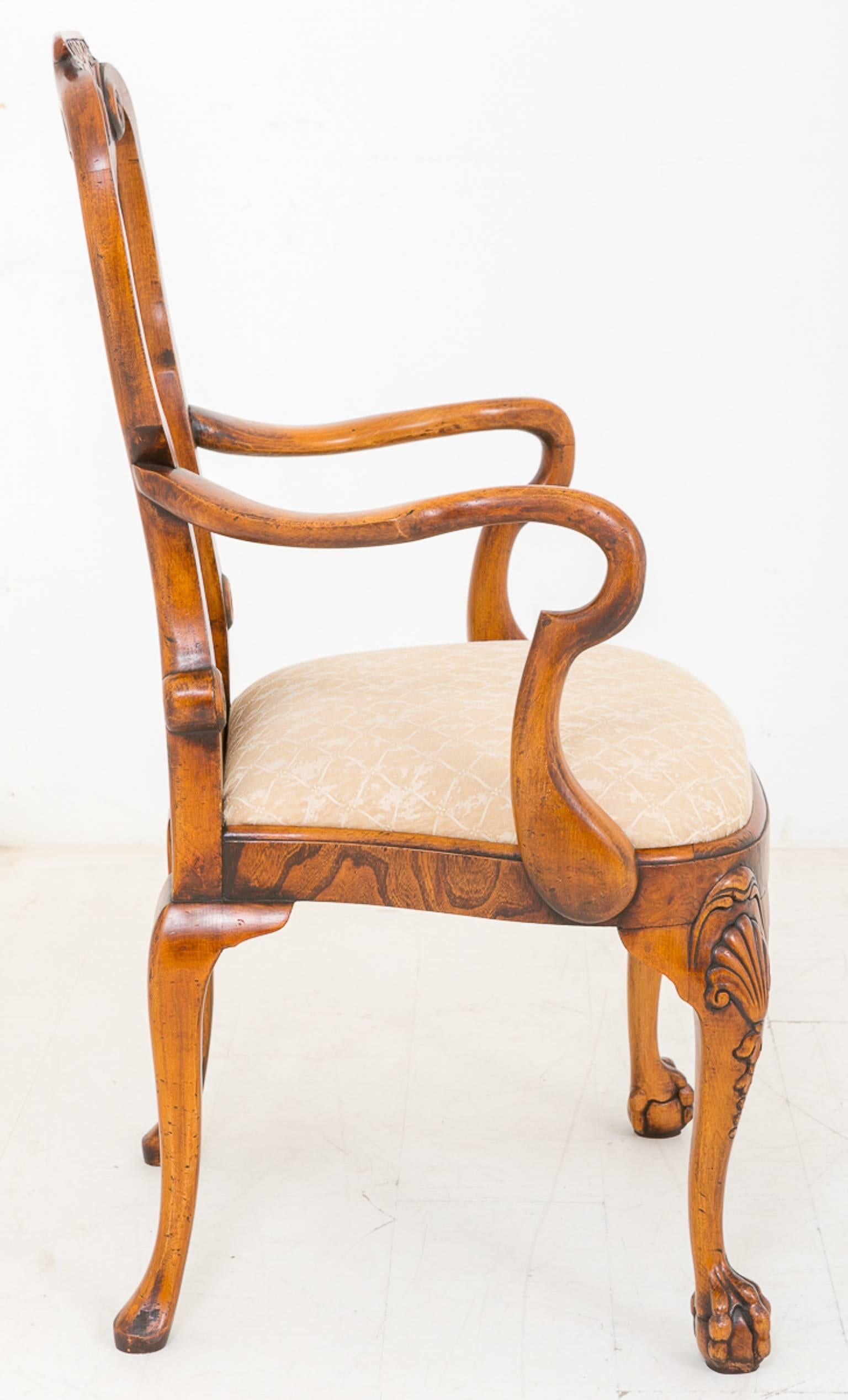 Superb set of 14 (12 and two) Queen Anne style burr elm chairs. Standing on a swept leg with a ball and claw foot with a carved shell to the knees.
The shaped seats having recently been upholstered.
The back splat being typical of early 18th
