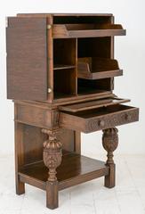 Unusual Carved Oak and Leather Cabinet