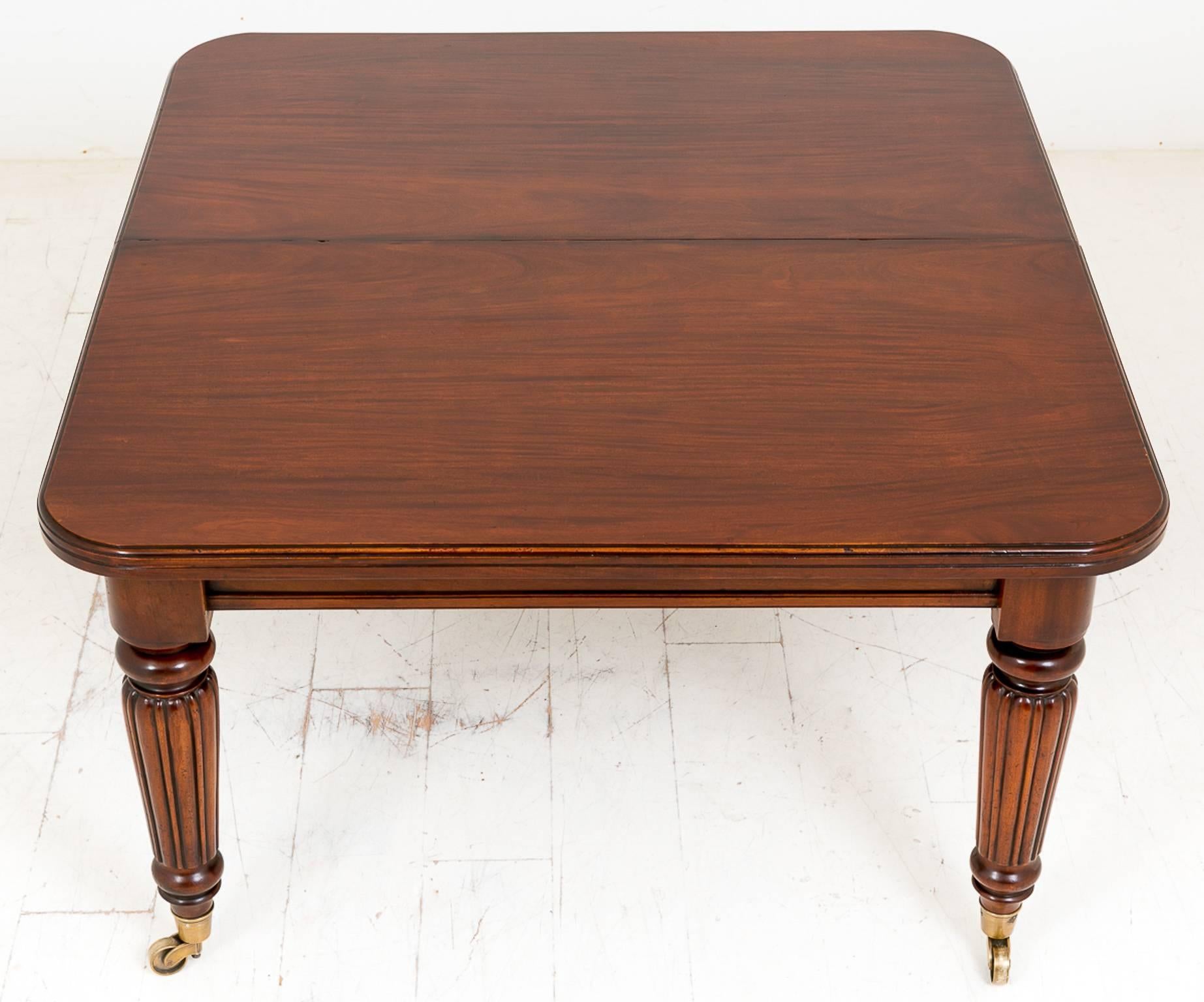 Mid-Victorian mahogany extending dining tale, standing on large brass castors with a turned and fluted leg.
This table features three extra leaves making this a very versatile table.
Comes with a wind out mechanism with a rather nice makers plaque
