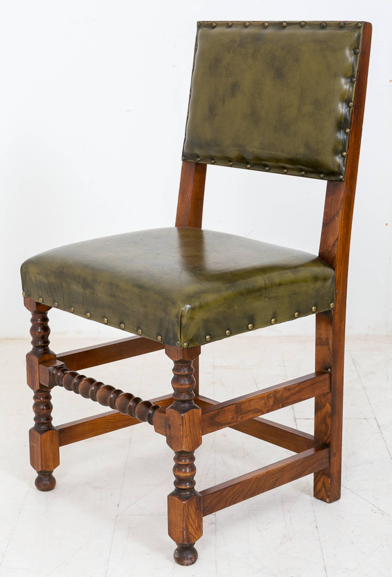 A good set of 14 oak Jacobean style chairs.
Having bobbin turned legs and front stretcher.
These chairs have recently been recovered in green leather with brass stud work.

Size singles:
height 36