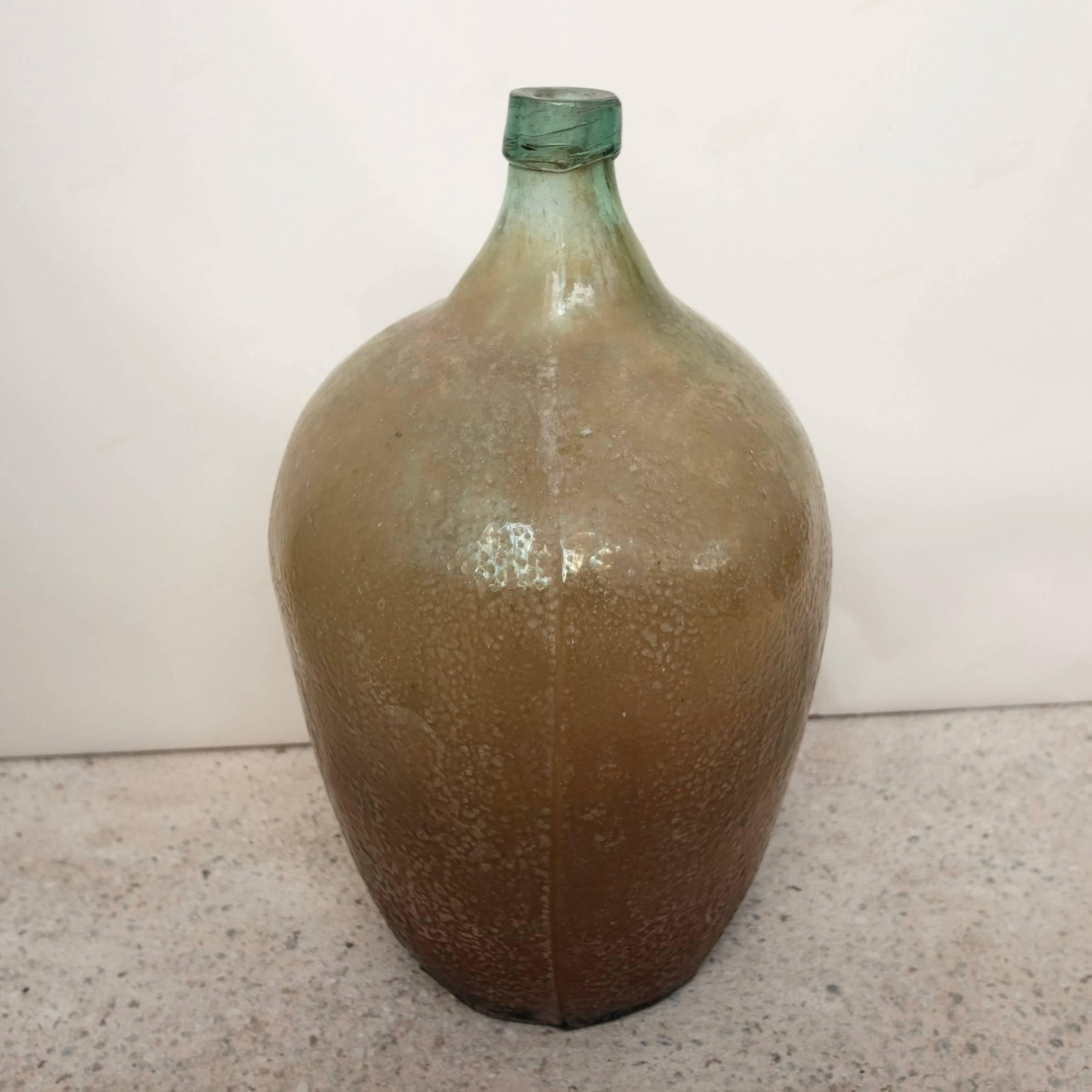 Rare, Vintage glass jug for storing mezcal from Southern Oaxaca. The imperfections on the bottle give these mezcal vessels their natural beauty.