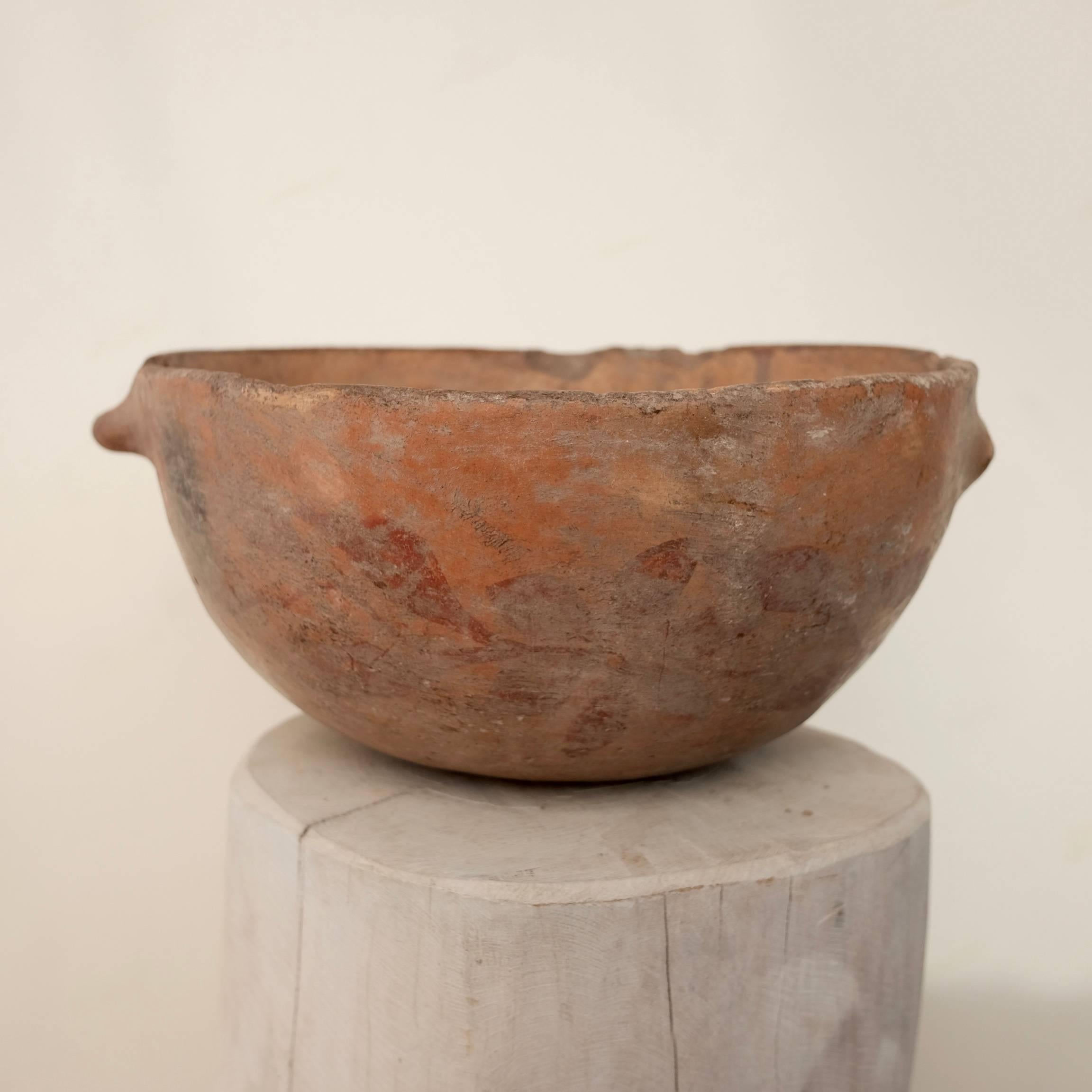 Light brown Siena colored functional bowl from the Zitlala region of Guerrero. One of the handles was damaged many years ago however given the wear of the damaged area, there is hardly any loss of aesthetic appeal.