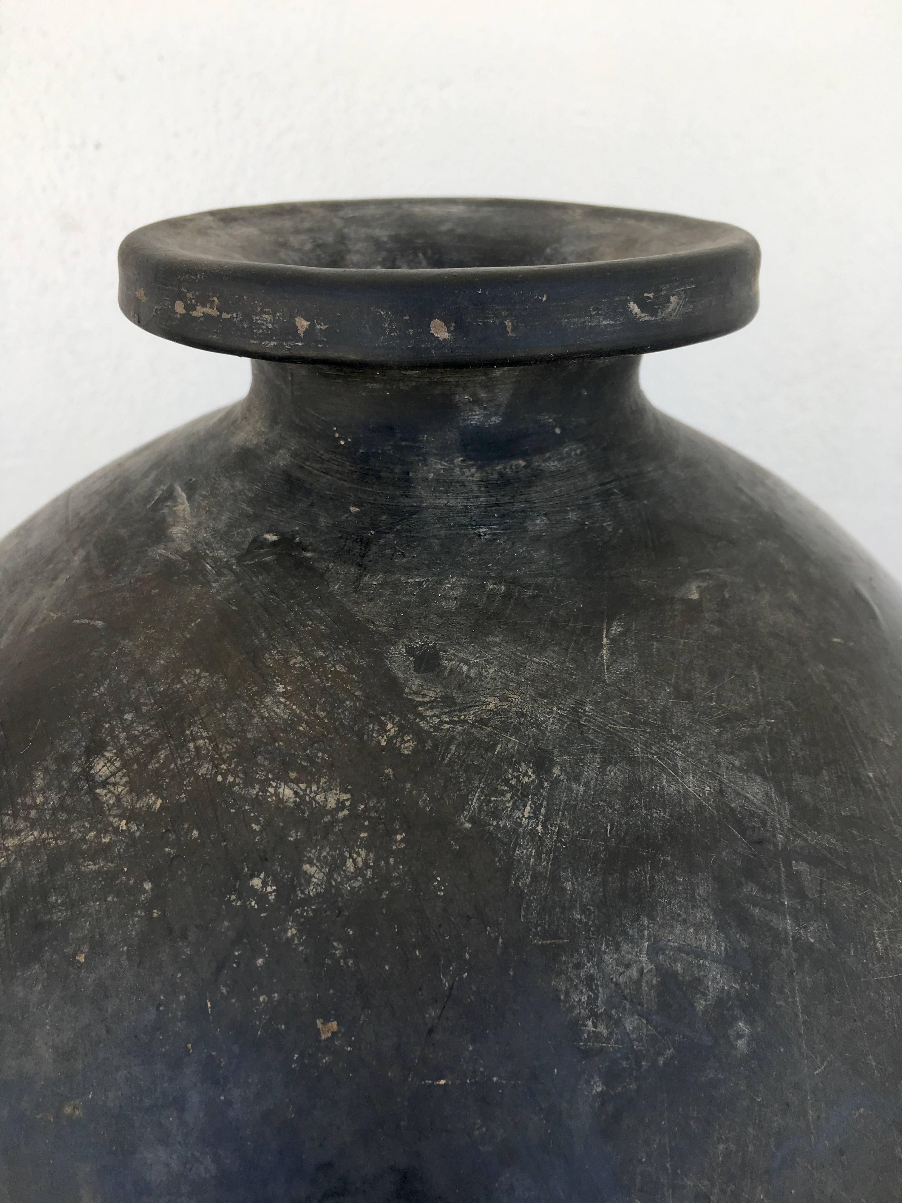 Vintage black clay teardrop vessel from the 1960s.