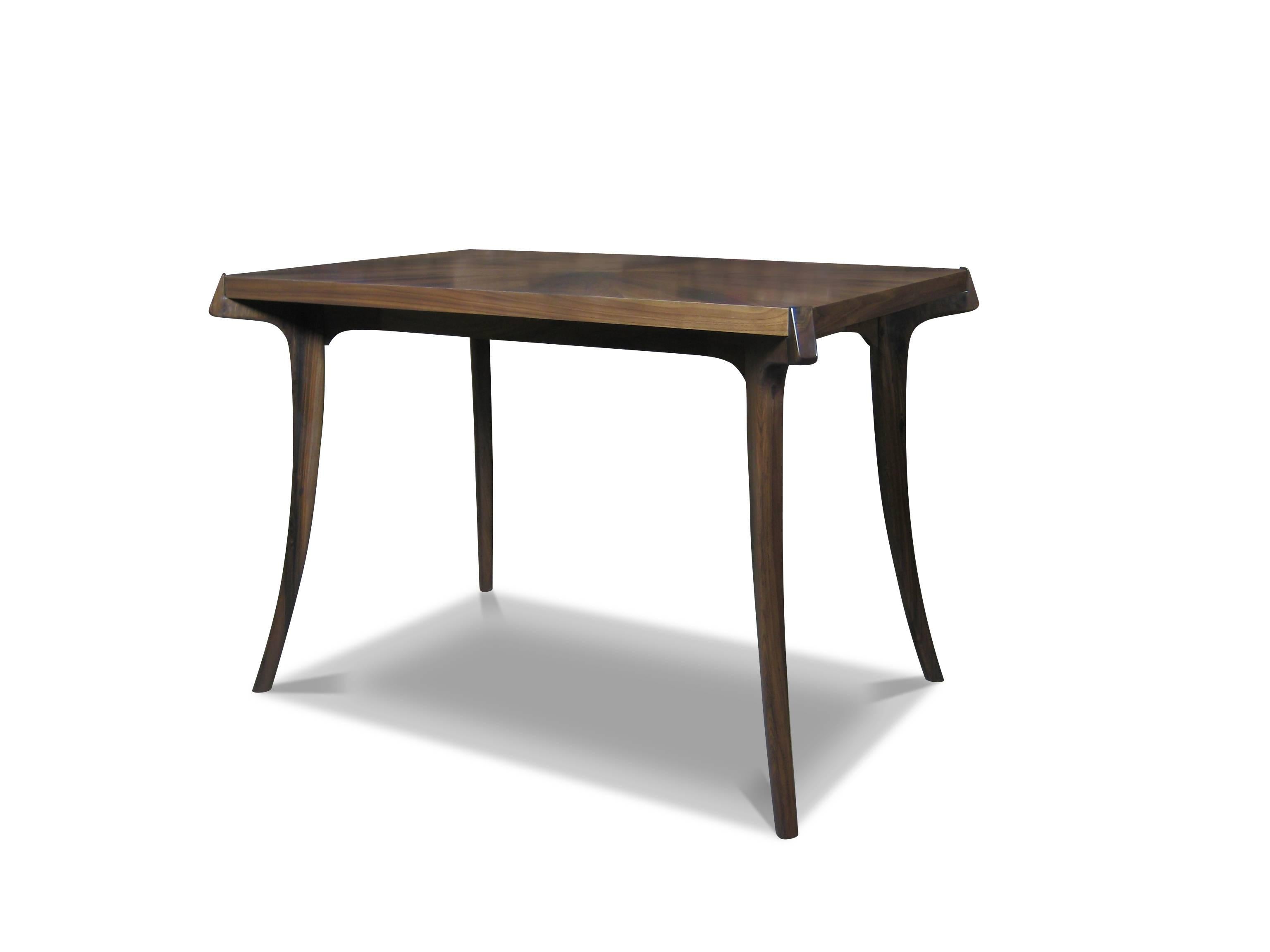 The Uccello Writing Desk is handcrafted one by one in Costantini's workshop in Buenos Aires. The surface of the table can be specified in any species of wood, or color, or really anything you can imagine. The sabre-legs give a nod to the form of the