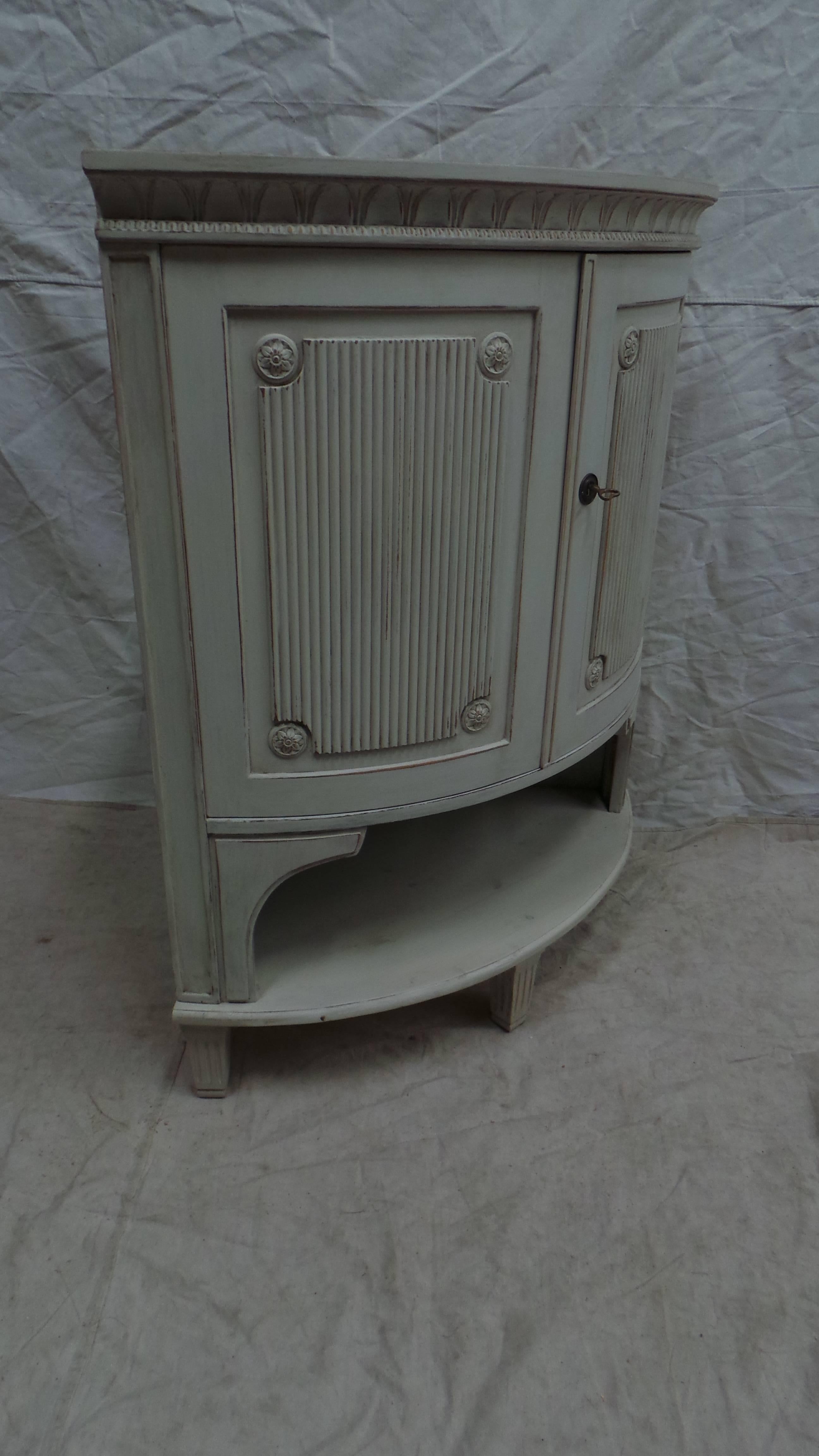 This is a unique Swedish Gustavian corner cabinet, these where used most often as a liqueur cabinet in a sitting room. its been restored and repainted with Milk Paints 
