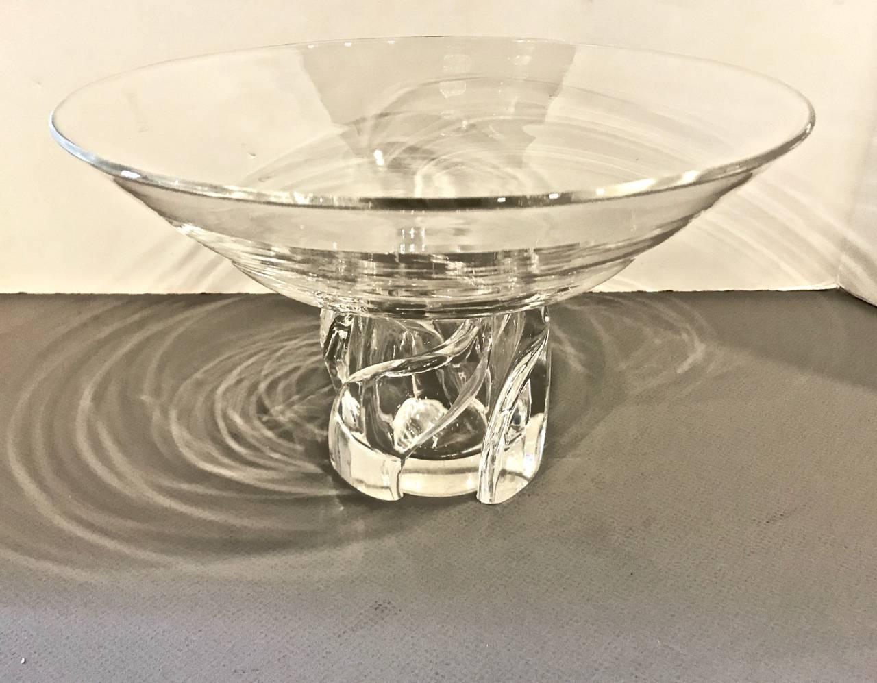 This is a stunning and unique Steuben pedestal bowl that dates to the second half of the 20th century. The bowl has the signature Steuben brilliance; the pedestal of the bowl swirls and is open to the bowl. The bottom diameter is 3.75 inches.