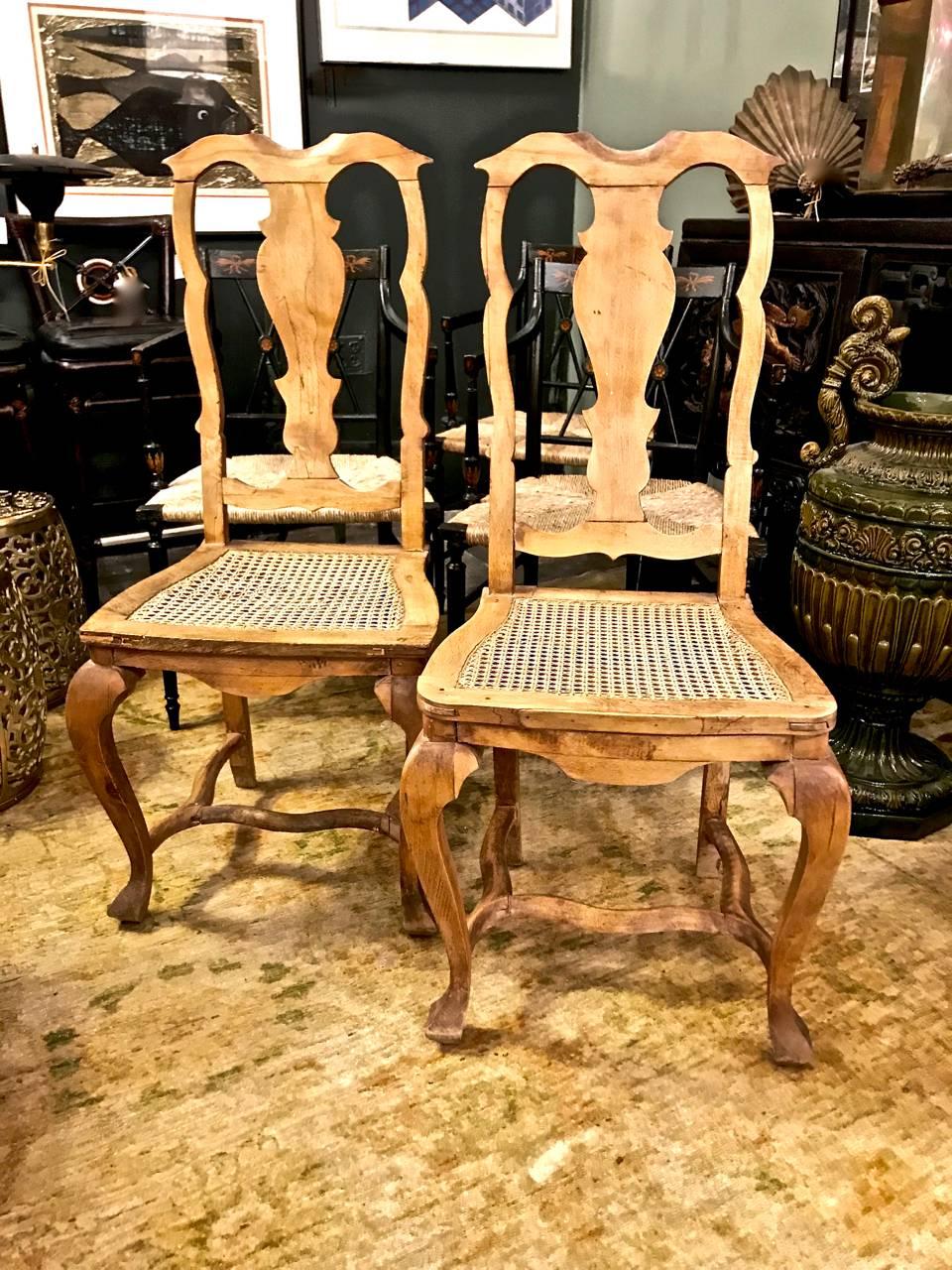 This is an unusual pair of 18th century Swedish side chairs. The chairs feature 