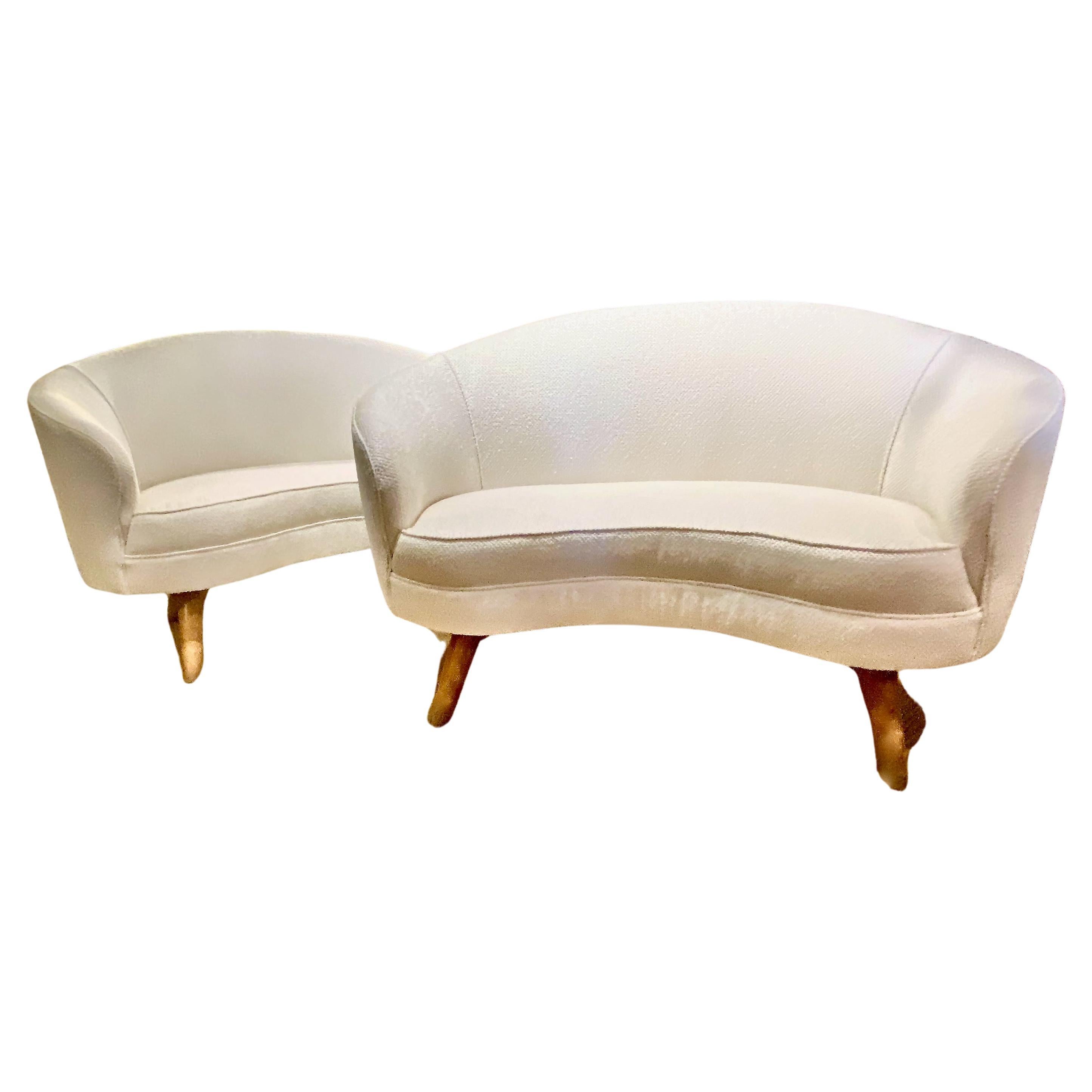 This is an unusual pair of Tor Wolfenstein small sofas that are newly upholstered in a high-end white boucle. The quality of design and condition of the sofas speak to their desirability. Tor Wolfenstein pieces are uncommon and highly desirable. A