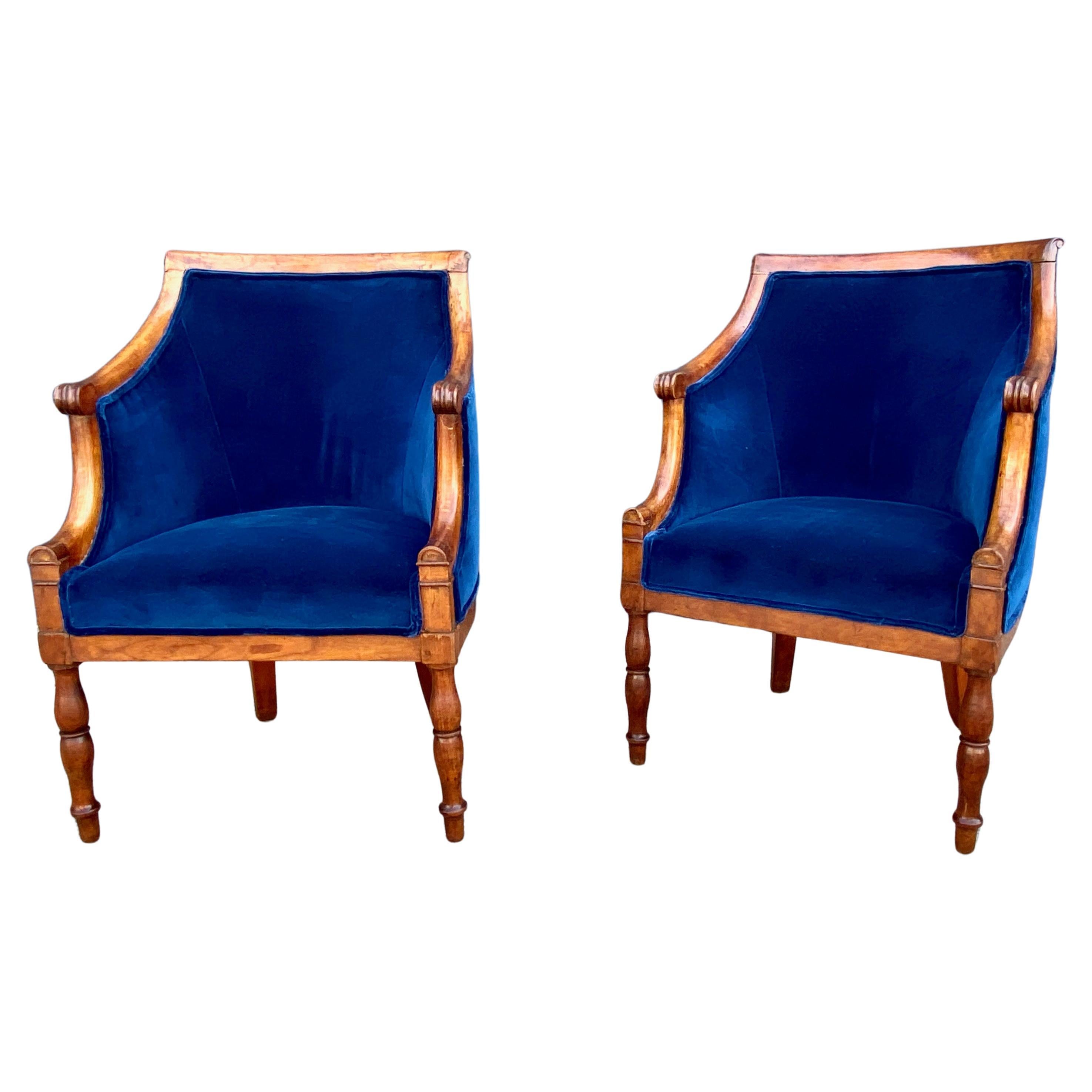 This is a very  desirable pair of period Lat Empire Barrel Back Bergeres that date to c. 1810-1820. The chairs have retained their original surface which we have cleaned and applied several coats of hard paste wax. The chairs are newly upholstered