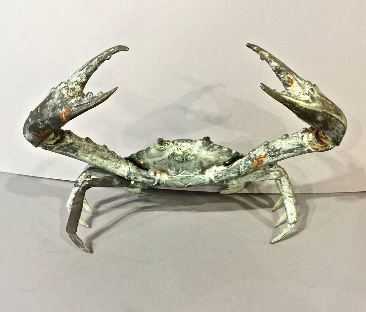 This is a finely detailed bronze reticulated crab. The crab is quite realistic and is in overall good condition with an old minor restoration to one leg. The crab is heavily patinated having lived a sized portion of its life out in the garden of