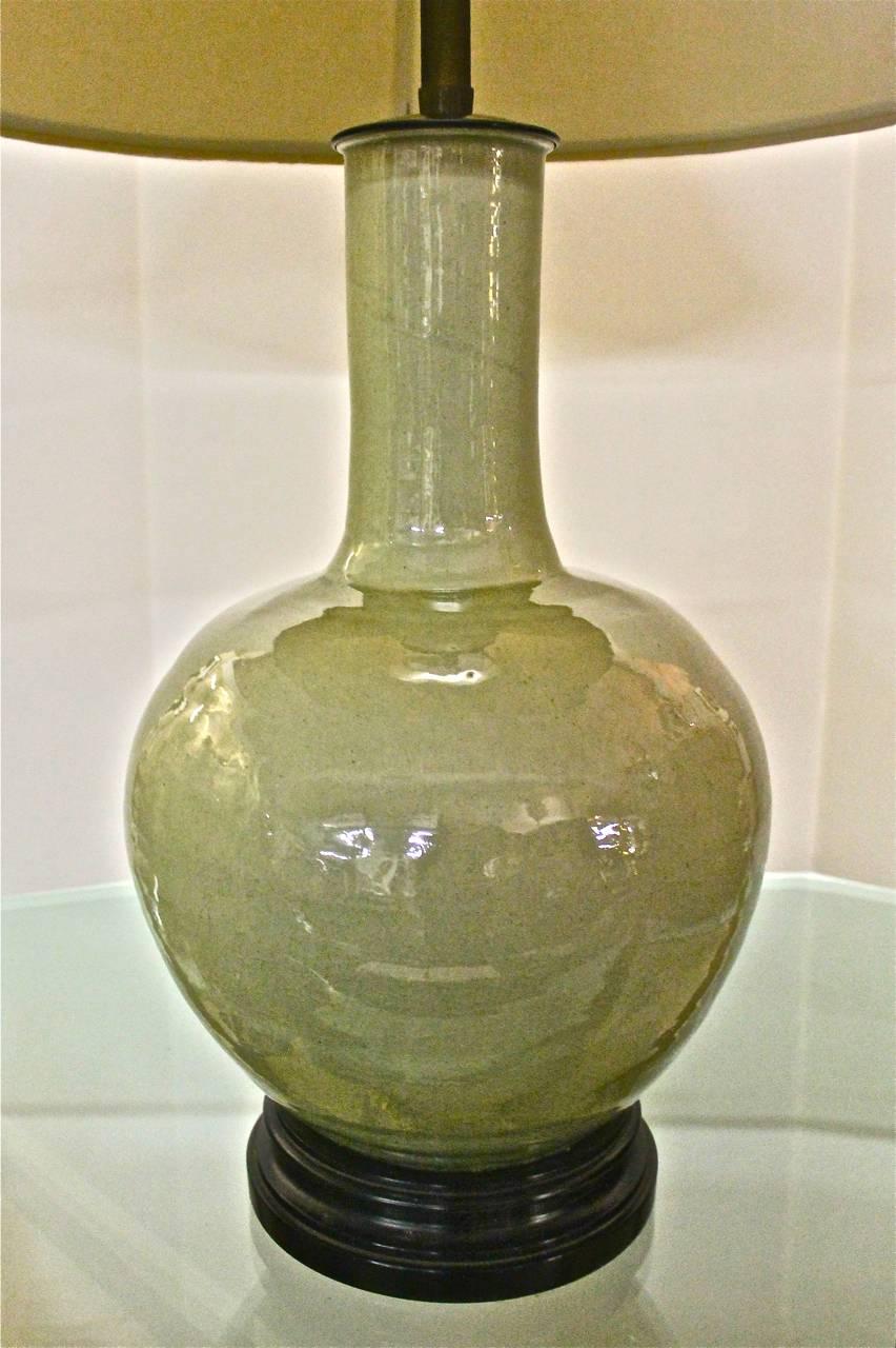 This is a stunning and large Chinese crackle glaze celadon vase that has been fitted with top quality lighting elements by the famed 20th century lighting company, Marbro. This is a heavily potted vessel that is in near mint condition (there are