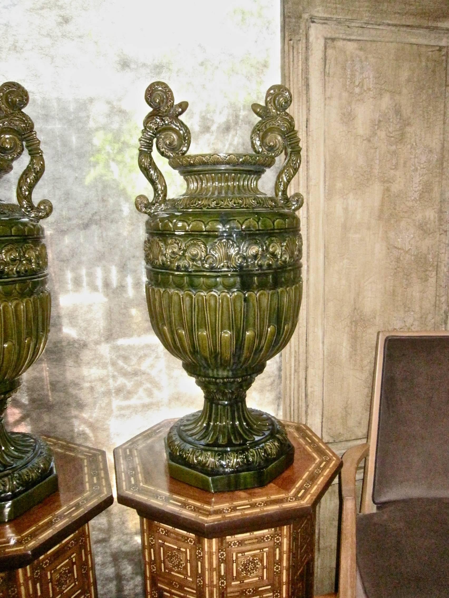This a stunning and very large pair of signed French Faience/Majolica handled urns by the famous French potter Jerome Massier Fils, Vallauris. The urns were created in the Renaissance Revival Style and date to, circa 1870-1880. The Massiers family